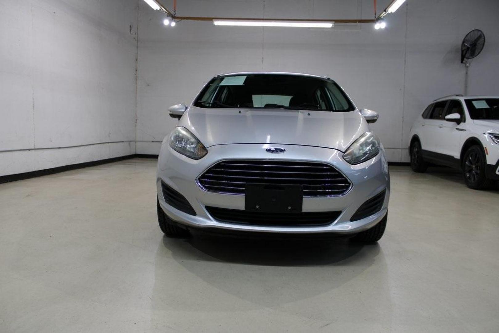 2016 Ingot Silver /Black Ford Fiesta SE (3FADP4EJ0GM) with an 1.6L I4 Ti-VCT engine, Automatic transmission, located at 15300 Midway Rd., Addison, TX, 75001, (972) 702-0011, 32.958321, -96.838074 - Introducing the 2016 Ford Fiesta SE, now available at Midway Auto Group in Addison, Texas. This compact sedan offers a perfect blend of efficiency, modern features, and spirited performance, making it an excellent choice for both city commutes and weekend adventures.<br><br>Key Features:<br><br>Engi - Photo#5