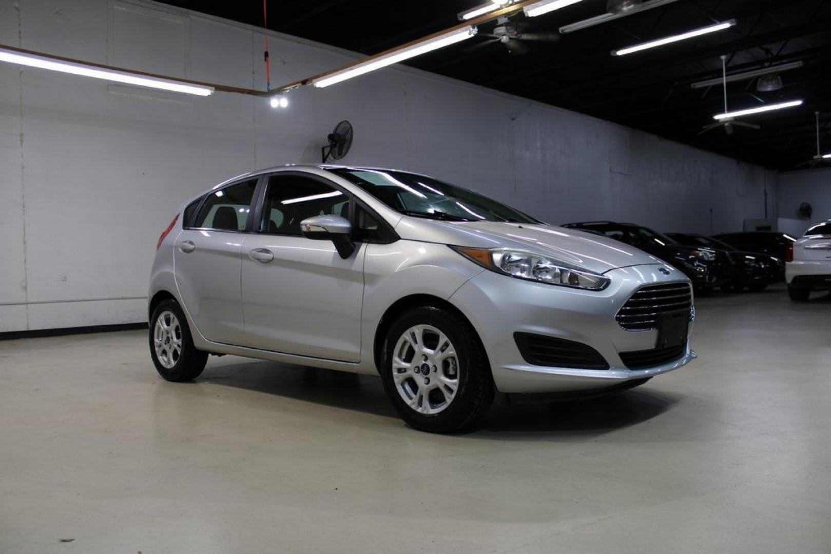 2016 Ingot Silver /Black Ford Fiesta SE (3FADP4EJ0GM) with an 1.6L I4 Ti-VCT engine, Automatic transmission, located at 15300 Midway Rd., Addison, TX, 75001, (972) 702-0011, 32.958321, -96.838074 - Introducing the 2016 Ford Fiesta SE, now available at Midway Auto Group in Addison, Texas. This compact sedan offers a perfect blend of efficiency, modern features, and spirited performance, making it an excellent choice for both city commutes and weekend adventures.<br><br>Key Features:<br><br>Engi - Photo#6