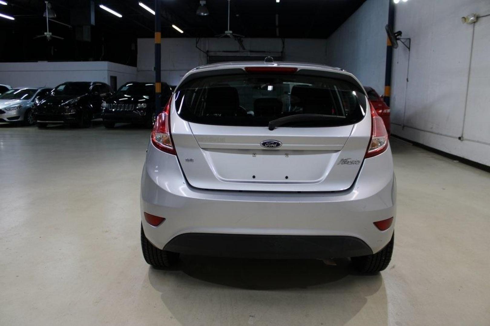 2016 Ingot Silver /Black Ford Fiesta SE (3FADP4EJ0GM) with an 1.6L I4 Ti-VCT engine, Automatic transmission, located at 15300 Midway Rd., Addison, TX, 75001, (972) 702-0011, 32.958321, -96.838074 - Introducing the 2016 Ford Fiesta SE, now available at Midway Auto Group in Addison, Texas. This compact sedan offers a perfect blend of efficiency, modern features, and spirited performance, making it an excellent choice for both city commutes and weekend adventures.<br><br>Key Features:<br><br>Engi - Photo#7