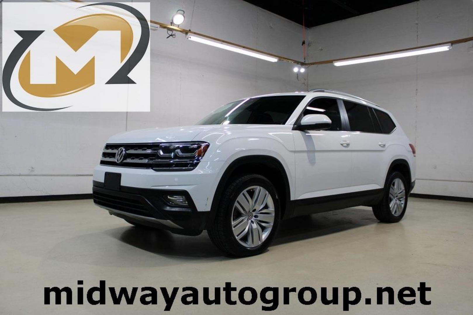 2019 Pure White /Titan Black Volkswagen Atlas 3.6L V6 SE (1V2WR2CA7KC) with an 3.6L VR6 engine, Automatic transmission, located at 15300 Midway Rd., Addison, TX, 75001, (972) 702-0011, 32.958321, -96.838074 - HOME OF THE NO HAGGLE PRICE - WHOLESALE PRICES TO THE PUBLIC!! Atlas 3.6L V6 SE w/Technology, 4D Sport Utility, 3.6L VR6, 8-Speed Automatic with Tiptronic, FWD.<br><br>Deep Black Pearl 2019 Volkswagen Atlas 3.6L V6 SE<br><br><br>Awards:<br> * 2019 KBB.com 12 Best Family Cars * 2019 KBB.com 10 Bes - Photo#0