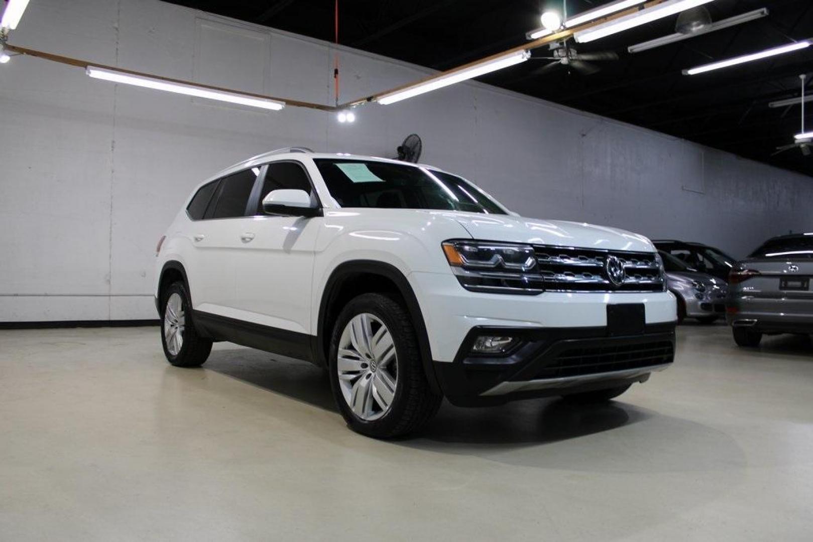 2019 Pure White /Titan Black Volkswagen Atlas 3.6L V6 SE (1V2WR2CA7KC) with an 3.6L VR6 engine, Automatic transmission, located at 15300 Midway Rd., Addison, TX, 75001, (972) 702-0011, 32.958321, -96.838074 - HOME OF THE NO HAGGLE PRICE - WHOLESALE PRICES TO THE PUBLIC!! Atlas 3.6L V6 SE w/Technology, 4D Sport Utility, 3.6L VR6, 8-Speed Automatic with Tiptronic, FWD.<br><br>Deep Black Pearl 2019 Volkswagen Atlas 3.6L V6 SE<br><br><br>Awards:<br> * 2019 KBB.com 12 Best Family Cars * 2019 KBB.com 10 Bes - Photo#1