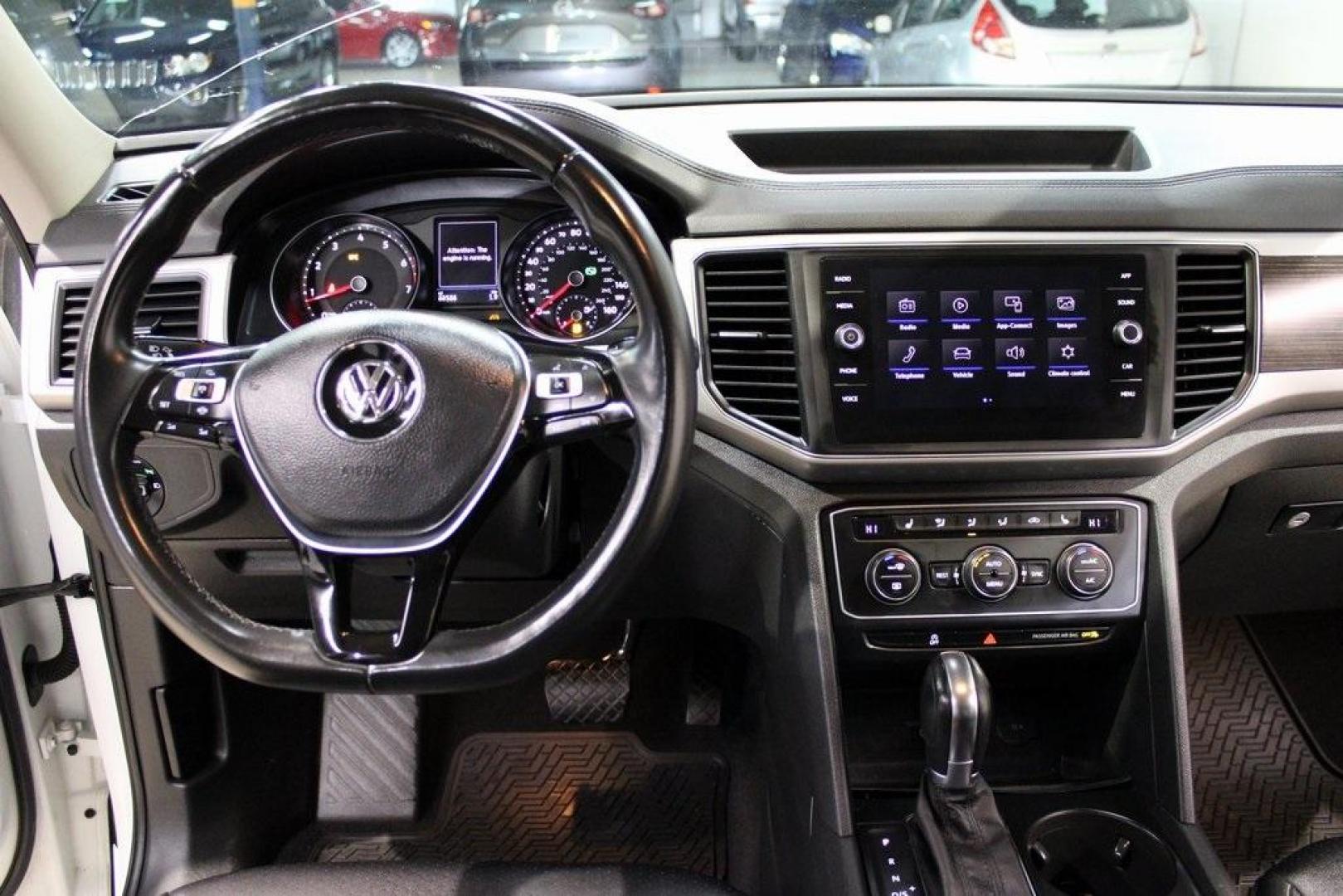 2019 Pure White /Titan Black Volkswagen Atlas 3.6L V6 SE (1V2WR2CA7KC) with an 3.6L VR6 engine, Automatic transmission, located at 15300 Midway Rd., Addison, TX, 75001, (972) 702-0011, 32.958321, -96.838074 - HOME OF THE NO HAGGLE PRICE - WHOLESALE PRICES TO THE PUBLIC!! Atlas 3.6L V6 SE w/Technology, 4D Sport Utility, 3.6L VR6, 8-Speed Automatic with Tiptronic, FWD.<br><br>Deep Black Pearl 2019 Volkswagen Atlas 3.6L V6 SE<br><br><br>Awards:<br> * 2019 KBB.com 12 Best Family Cars * 2019 KBB.com 10 Bes - Photo#19