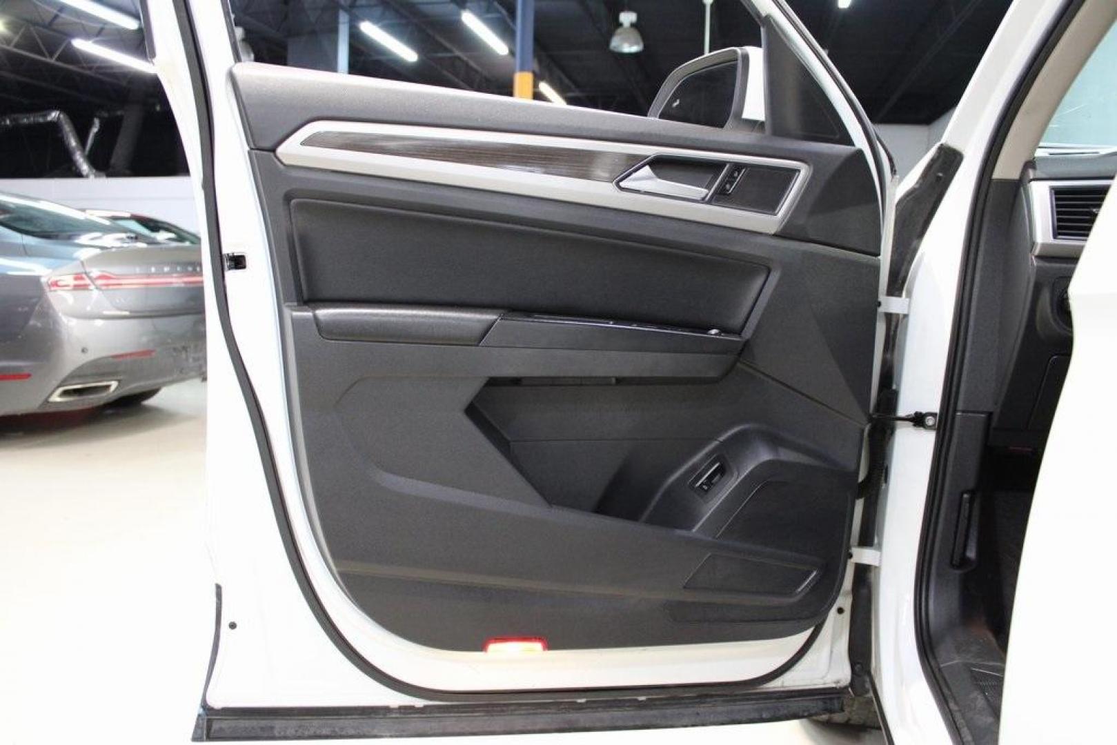 2019 Pure White /Titan Black Volkswagen Atlas 3.6L V6 SE (1V2WR2CA7KC) with an 3.6L VR6 engine, Automatic transmission, located at 15300 Midway Rd., Addison, TX, 75001, (972) 702-0011, 32.958321, -96.838074 - HOME OF THE NO HAGGLE PRICE - WHOLESALE PRICES TO THE PUBLIC!! Atlas 3.6L V6 SE w/Technology, 4D Sport Utility, 3.6L VR6, 8-Speed Automatic with Tiptronic, FWD.<br><br>Deep Black Pearl 2019 Volkswagen Atlas 3.6L V6 SE<br><br><br>Awards:<br> * 2019 KBB.com 12 Best Family Cars * 2019 KBB.com 10 Bes - Photo#29