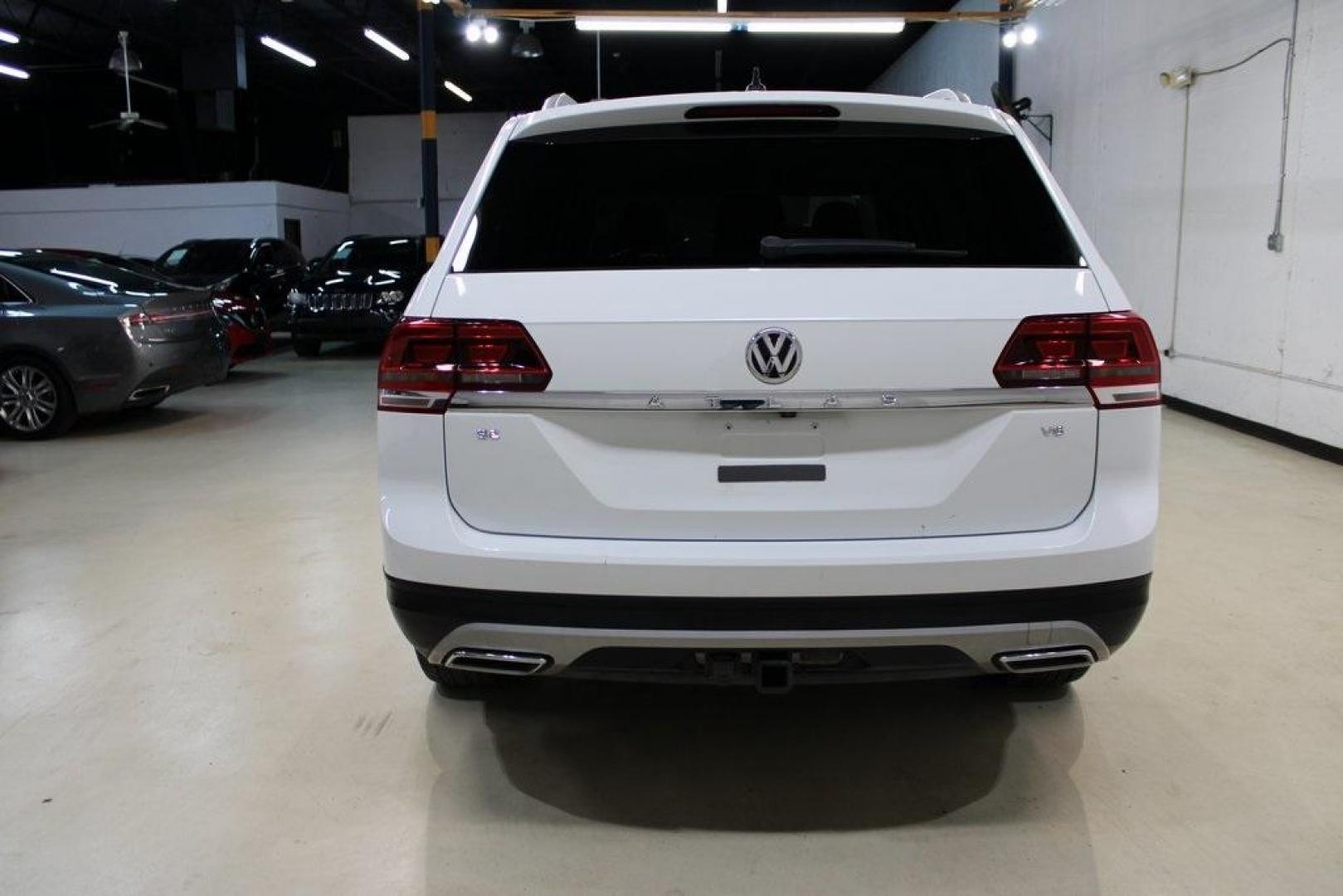 2019 Pure White /Titan Black Volkswagen Atlas 3.6L V6 SE (1V2WR2CA7KC) with an 3.6L VR6 engine, Automatic transmission, located at 15300 Midway Rd., Addison, TX, 75001, (972) 702-0011, 32.958321, -96.838074 - HOME OF THE NO HAGGLE PRICE - WHOLESALE PRICES TO THE PUBLIC!! Atlas 3.6L V6 SE w/Technology, 4D Sport Utility, 3.6L VR6, 8-Speed Automatic with Tiptronic, FWD.<br><br>Deep Black Pearl 2019 Volkswagen Atlas 3.6L V6 SE<br><br><br>Awards:<br> * 2019 KBB.com 12 Best Family Cars * 2019 KBB.com 10 Bes - Photo#7