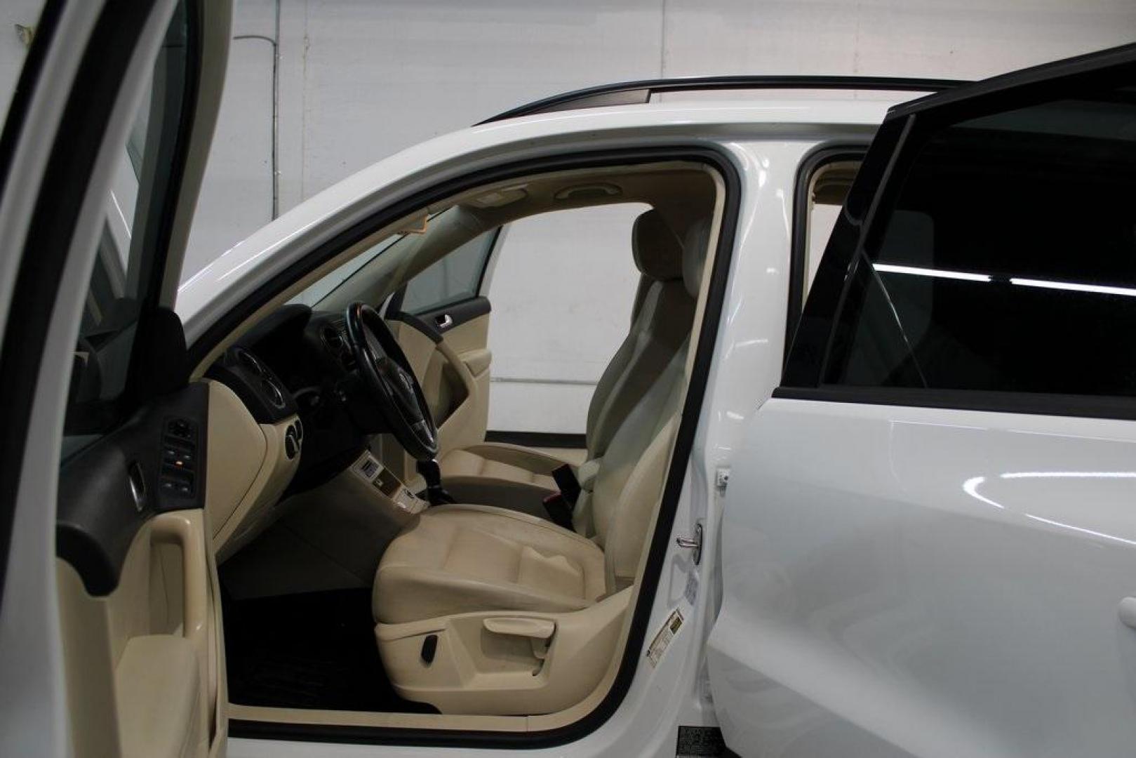 2016 Pure White Volkswagen Tiguan S (WVGAV7AX2GW) with an 2.0L 4-Cylinder Turbocharged engine, Automatic transmission, located at 15300 Midway Rd., Addison, TX, 75001, (972) 702-0011, 32.958321, -96.838074 - Photo#13