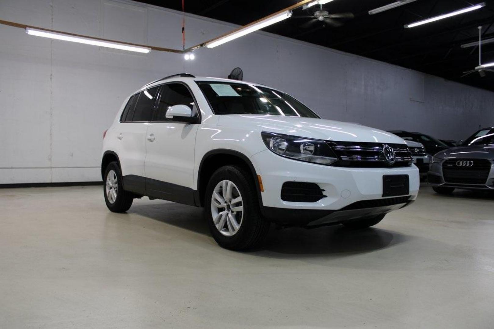 2016 Pure White Volkswagen Tiguan S (WVGAV7AX2GW) with an 2.0L 4-Cylinder Turbocharged engine, Automatic transmission, located at 15300 Midway Rd., Addison, TX, 75001, (972) 702-0011, 32.958321, -96.838074 - Photo#1