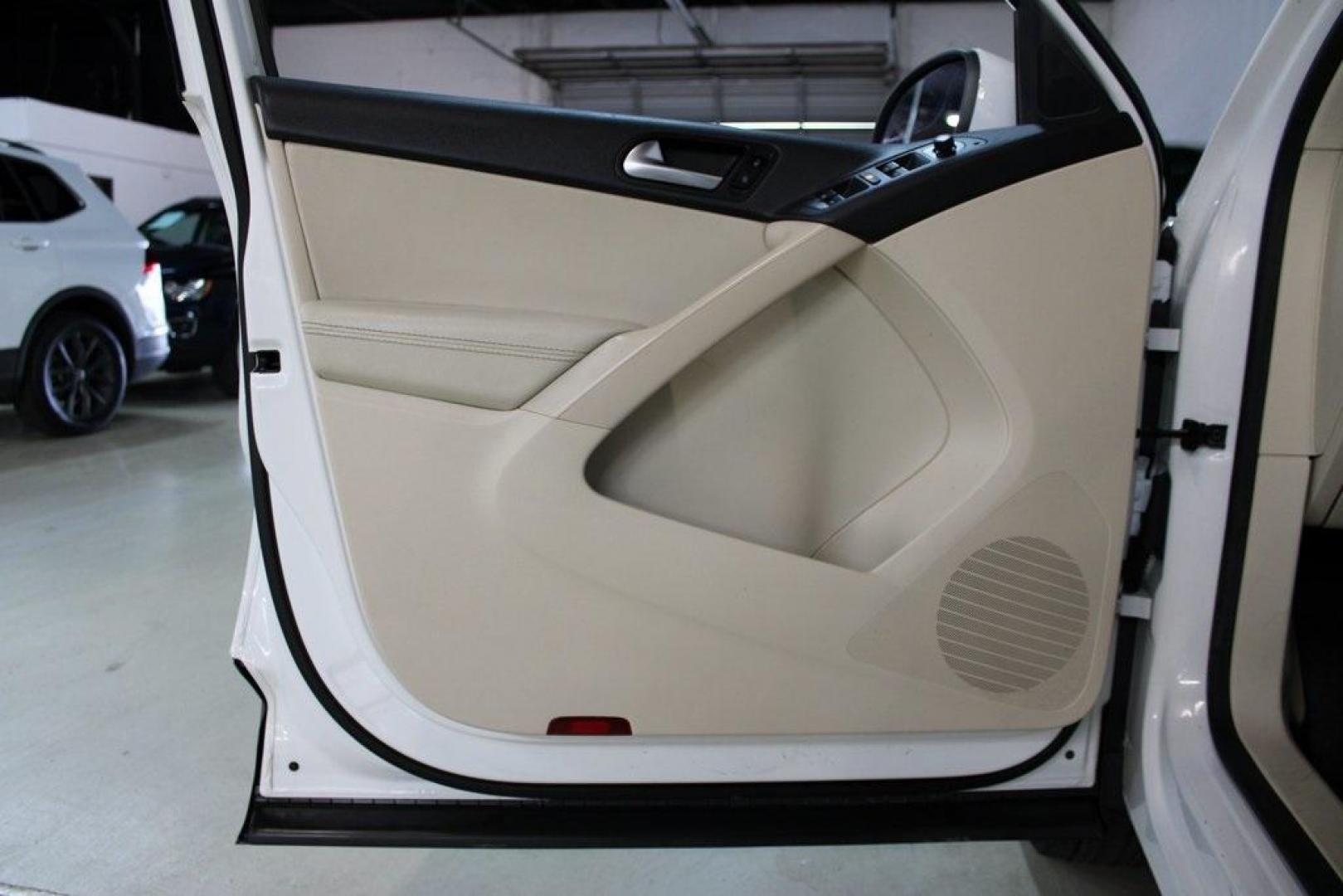 2016 Pure White Volkswagen Tiguan S (WVGAV7AX2GW) with an 2.0L 4-Cylinder Turbocharged engine, Automatic transmission, located at 15300 Midway Rd., Addison, TX, 75001, (972) 702-0011, 32.958321, -96.838074 - Photo#24