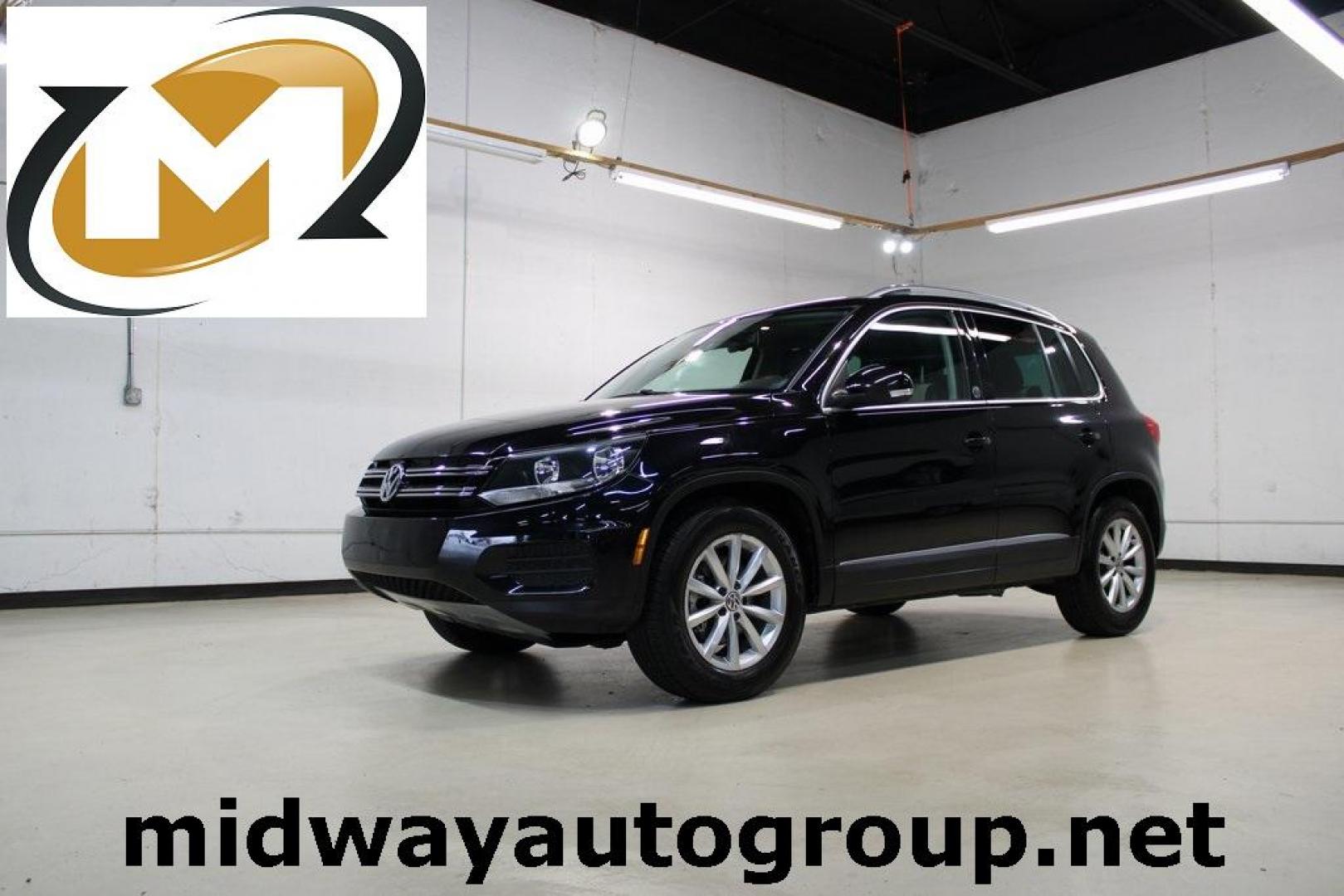 2017 Deep Black /Beige/Black Volkswagen Tiguan 2.0T Wolfsburg Edition (WVGRV7AX9HW) with an 2.0L TSI DOHC engine, Automatic transmission, located at 15300 Midway Rd., Addison, TX, 75001, (972) 702-0011, 32.958321, -96.838074 - Photo#0