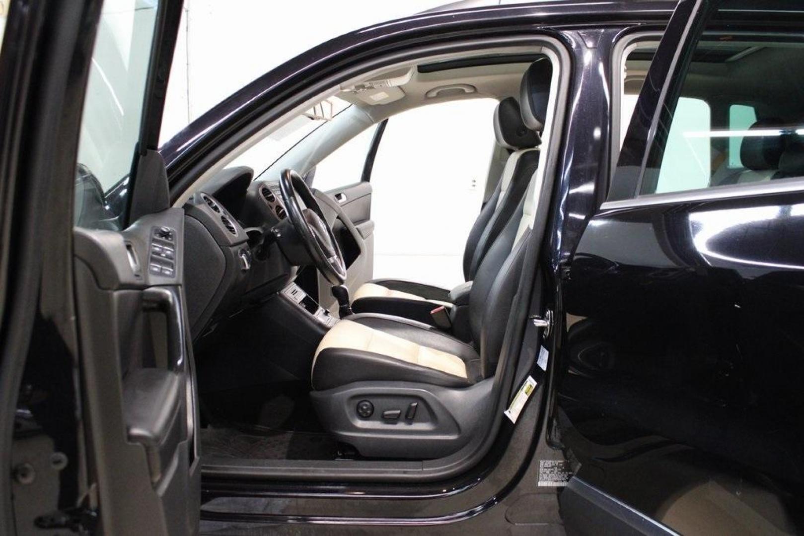 2017 Deep Black /Beige/Black Volkswagen Tiguan 2.0T Wolfsburg Edition (WVGRV7AX9HW) with an 2.0L TSI DOHC engine, Automatic transmission, located at 15300 Midway Rd., Addison, TX, 75001, (972) 702-0011, 32.958321, -96.838074 - Photo#14