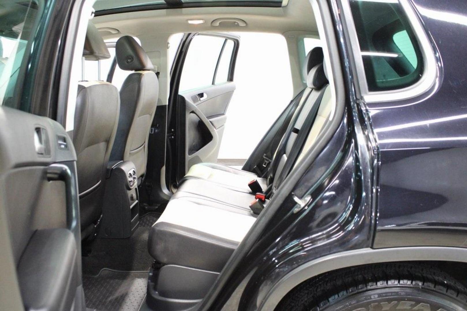 2017 Deep Black /Beige/Black Volkswagen Tiguan 2.0T Wolfsburg Edition (WVGRV7AX9HW) with an 2.0L TSI DOHC engine, Automatic transmission, located at 15300 Midway Rd., Addison, TX, 75001, (972) 702-0011, 32.958321, -96.838074 - Photo#17