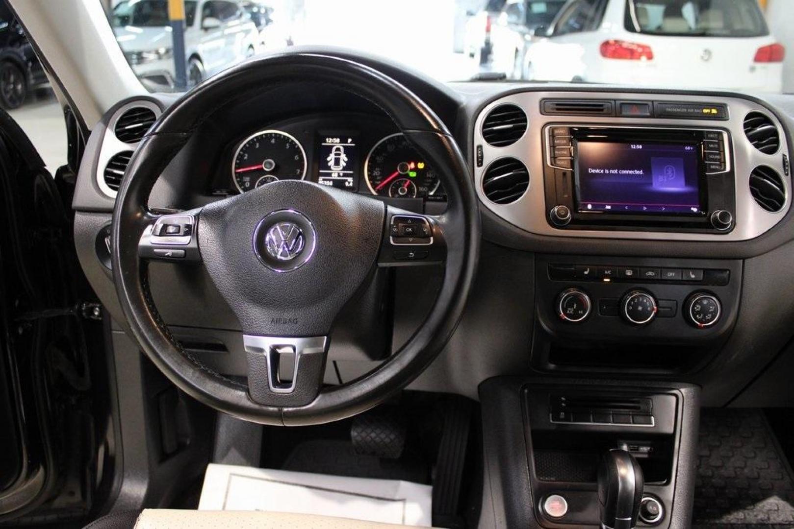 2017 Deep Black /Beige/Black Volkswagen Tiguan 2.0T Wolfsburg Edition (WVGRV7AX9HW) with an 2.0L TSI DOHC engine, Automatic transmission, located at 15300 Midway Rd., Addison, TX, 75001, (972) 702-0011, 32.958321, -96.838074 - Photo#18