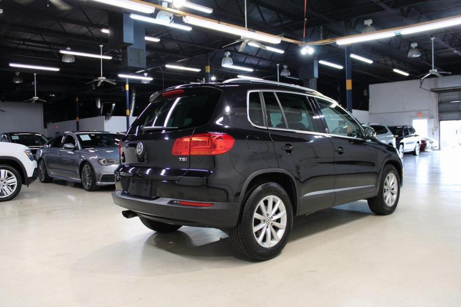 2017 Deep Black /Beige/Black Volkswagen Tiguan 2.0T Wolfsburg Edition (WVGRV7AX9HW) with an 2.0L TSI DOHC engine, Automatic transmission, located at 15300 Midway Rd., Addison, TX, 75001, (972) 702-0011, 32.958321, -96.838074 - Photo#2