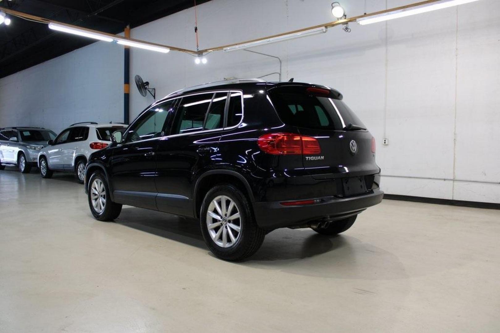 2017 Deep Black /Beige/Black Volkswagen Tiguan 2.0T Wolfsburg Edition (WVGRV7AX9HW) with an 2.0L TSI DOHC engine, Automatic transmission, located at 15300 Midway Rd., Addison, TX, 75001, (972) 702-0011, 32.958321, -96.838074 - Photo#3