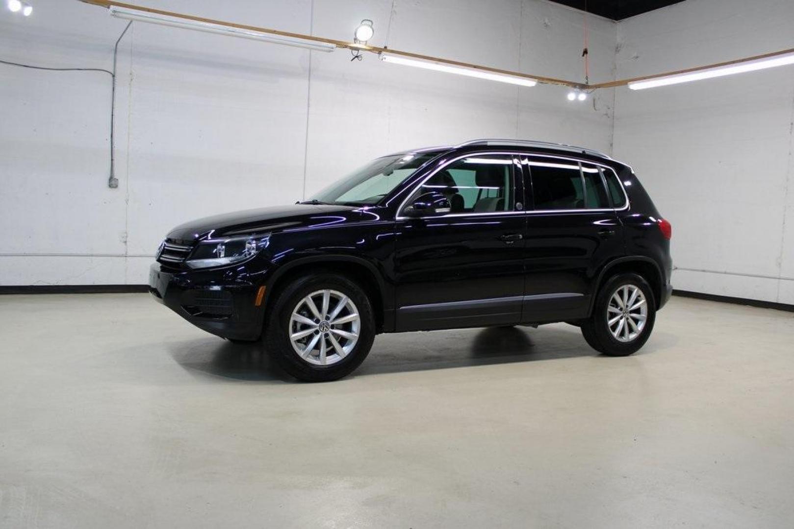 2017 Deep Black /Beige/Black Volkswagen Tiguan 2.0T Wolfsburg Edition (WVGRV7AX9HW) with an 2.0L TSI DOHC engine, Automatic transmission, located at 15300 Midway Rd., Addison, TX, 75001, (972) 702-0011, 32.958321, -96.838074 - Photo#4