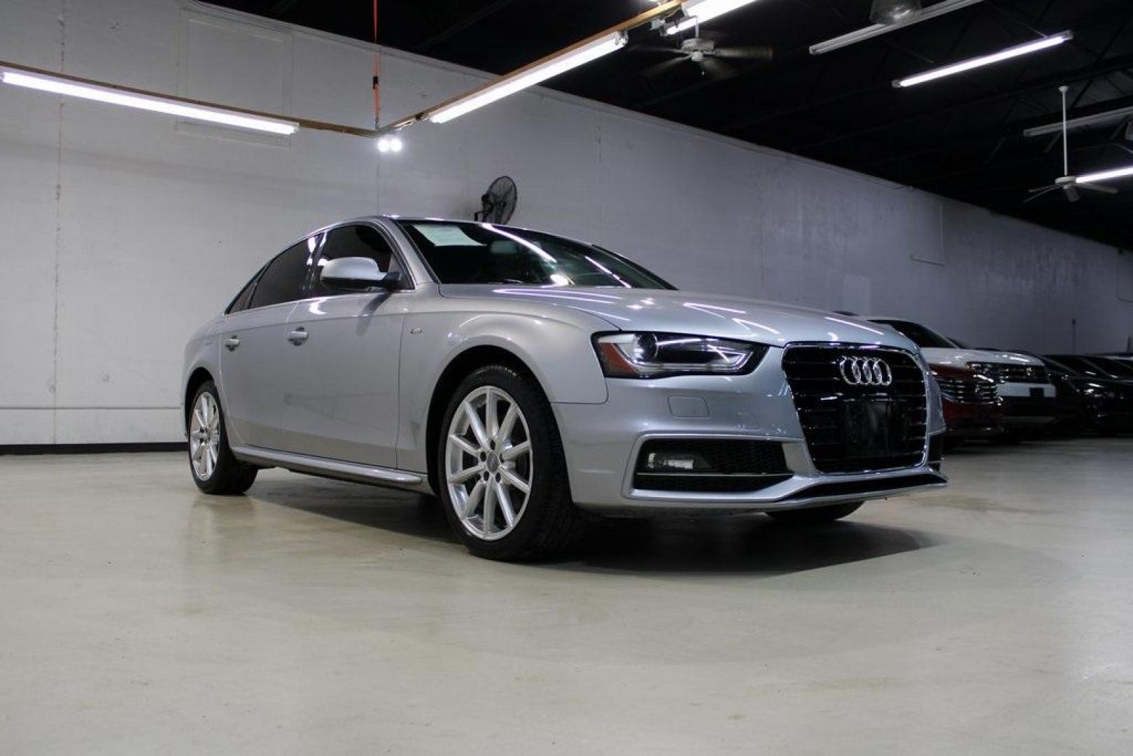 2016 Florett Silver Metallic Audi A4 2.0T Premium (WAUAFAFL7GN) with an 2.0L 4-Cylinder TFSI DOHC engine, CVT transmission, located at 15300 Midway Rd., Addison, TX, 75001, (972) 702-0011, 32.958321, -96.838074 - Photo#1