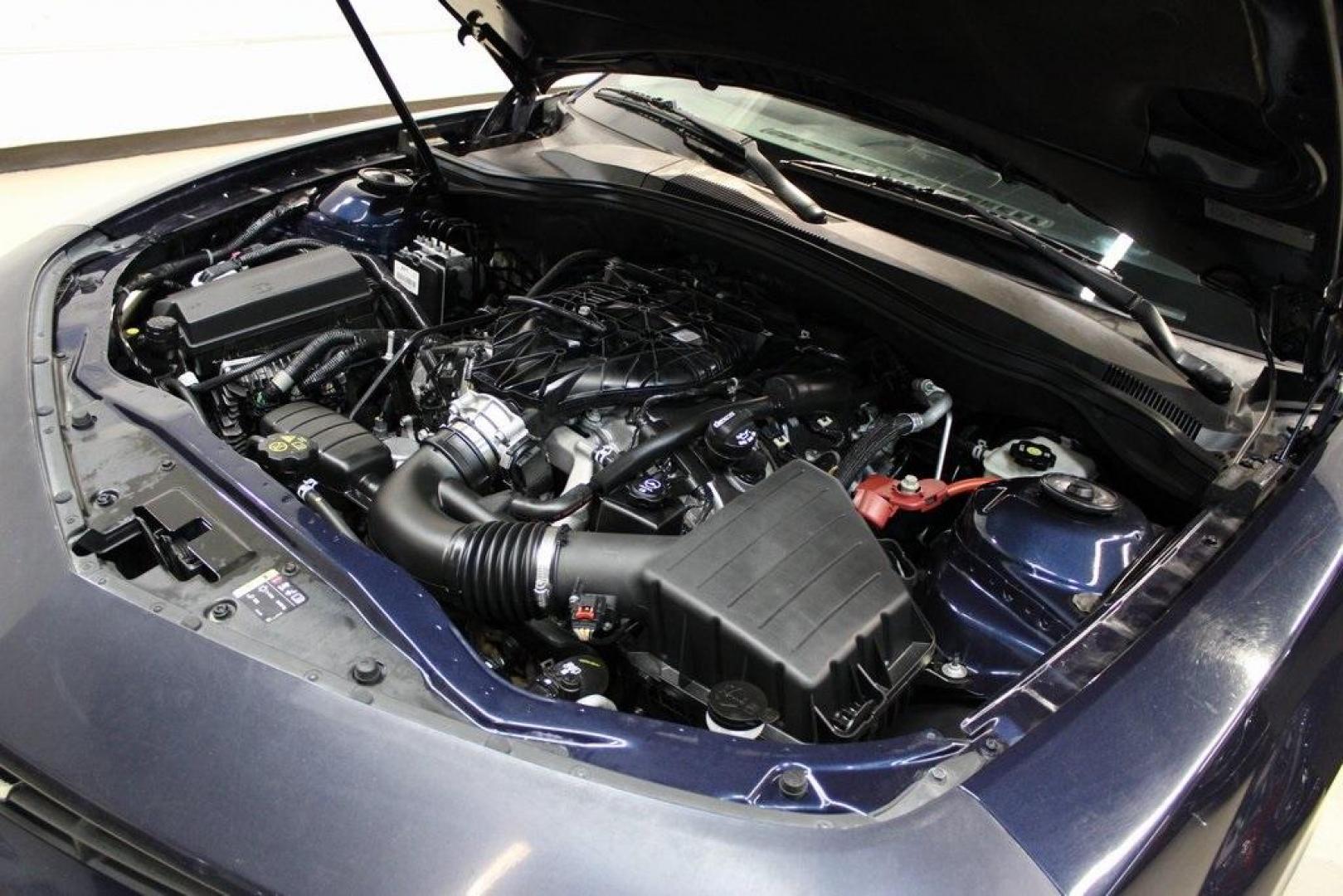 2015 Blue Velvet Metallic /Gray Chevrolet Camaro 1LS (2G1FA1E32F9) with an 3.6L V6 DGI DOHC VVT engine, Manual transmission, located at 15300 Midway Rd., Addison, TX, 75001, (972) 702-0011, 32.958321, -96.838074 - Unleash your inner driver with the 2015 Chevrolet Camaro 1LS Coupe, now available at Midway Auto Group in Addison, Texas. This iconic muscle car combines classic design with modern performance, offering an exhilarating driving experience that's hard to match.<br><br>Key Features:<br><br>Engine: 3.6L - Photo#25