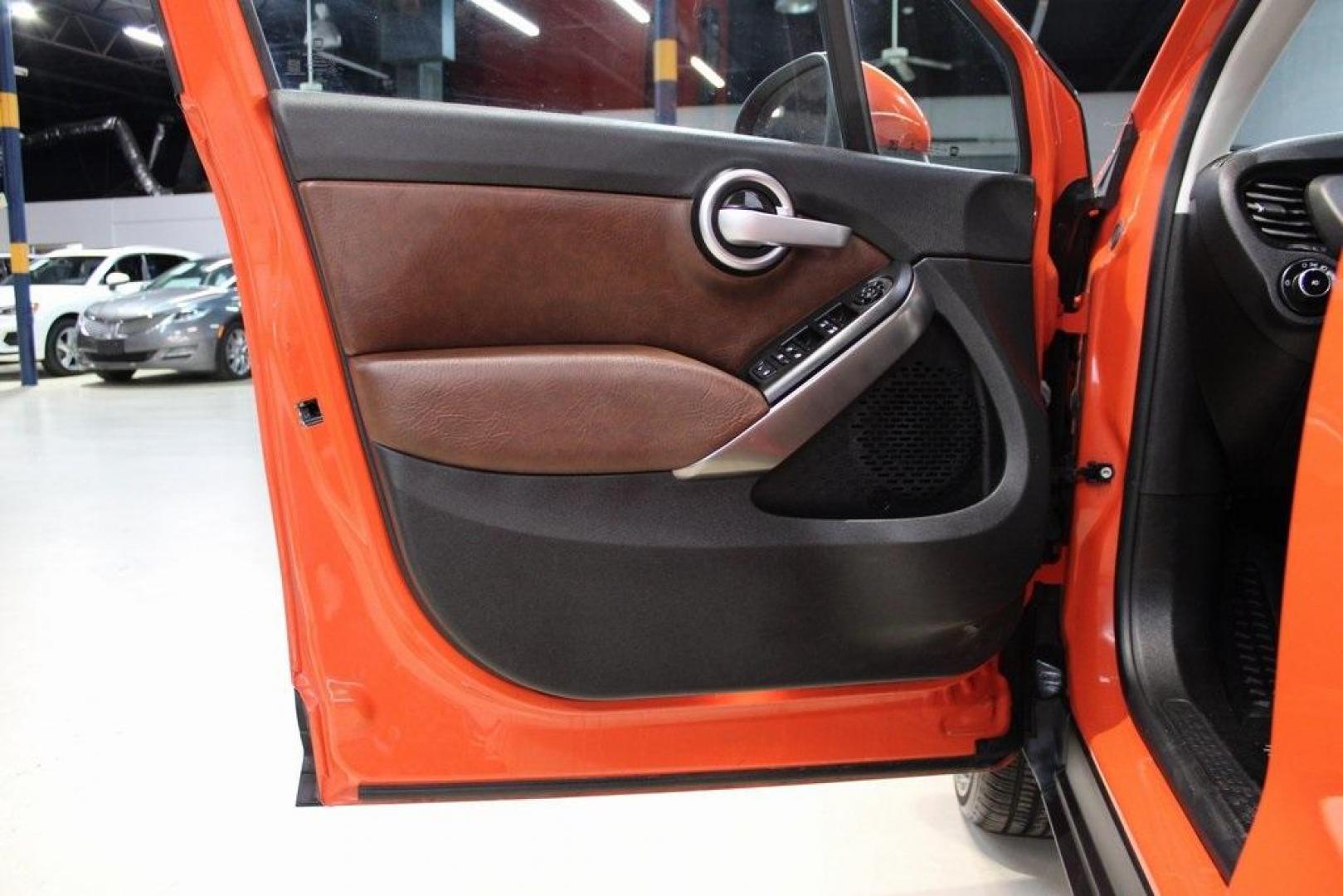 2016 Arancio (Orange) /Brown Fiat 500X Trekking Plus (ZFBCFYET8GP) with an 2.4L I4 MultiAir engine, Automatic transmission, located at 15300 Midway Rd., Addison, TX, 75001, (972) 702-0011, 32.958321, -96.838074 - Midway Auto Group in Addison, TX, is pleased to offer this 2016 Fiat 500X Trekking Plus, a subcompact crossover that combines Italian design flair with versatile functionality.<br><br>Key Features:<br><br>Engine and Performance: Powered by a 2.4-liter Tigershark MultiAir 2 inline-4 engine deliveri - Photo#27