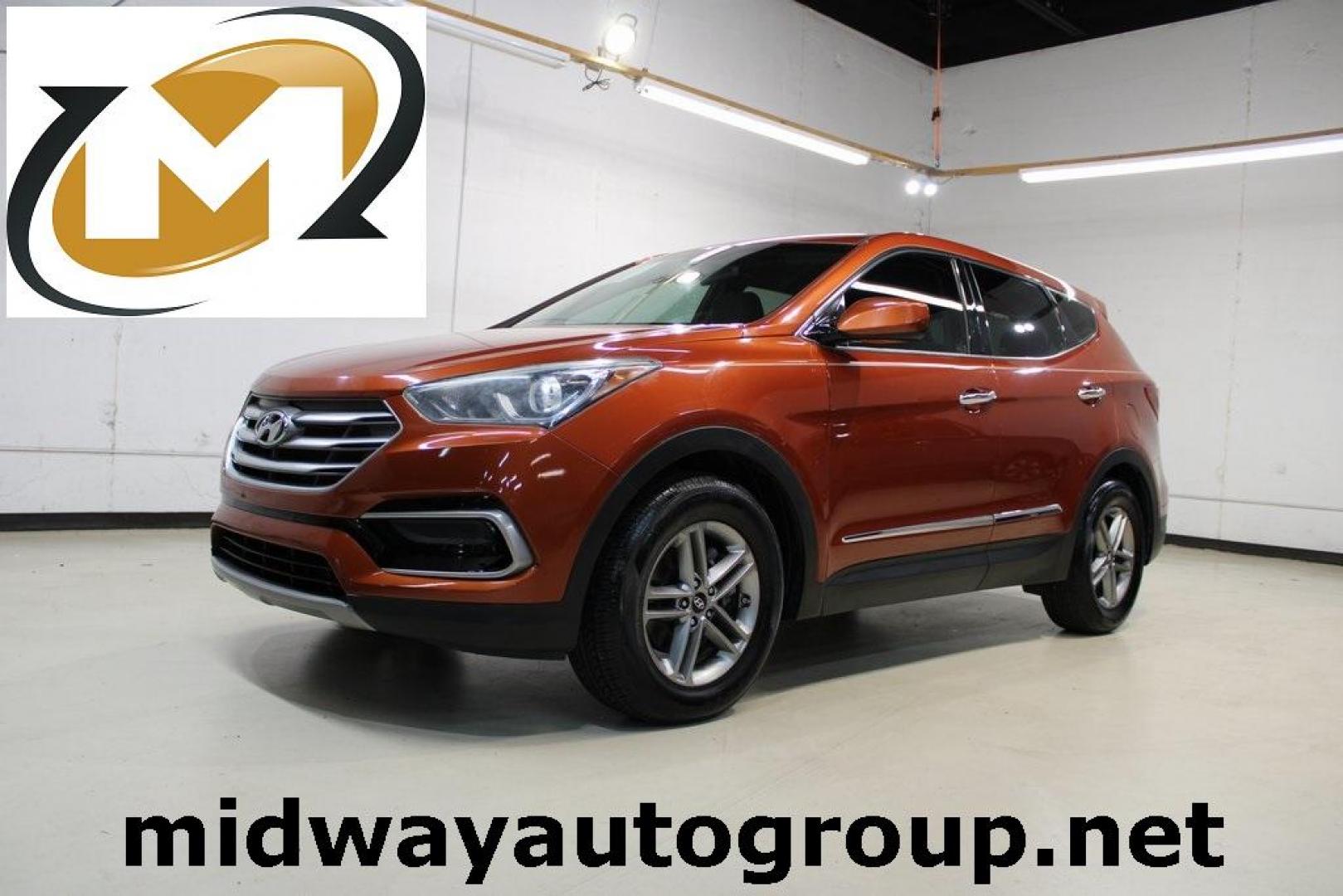 2017 Canyon Copper /Beige Hyundai Santa Fe Sport 2.4 Base (5XYZT3LB1HG) with an 2.4L I4 DGI DOHC 16V engine, Automatic transmission, located at 15300 Midway Rd., Addison, TX, 75001, (972) 702-0011, 32.958321, -96.838074 - Photo#0
