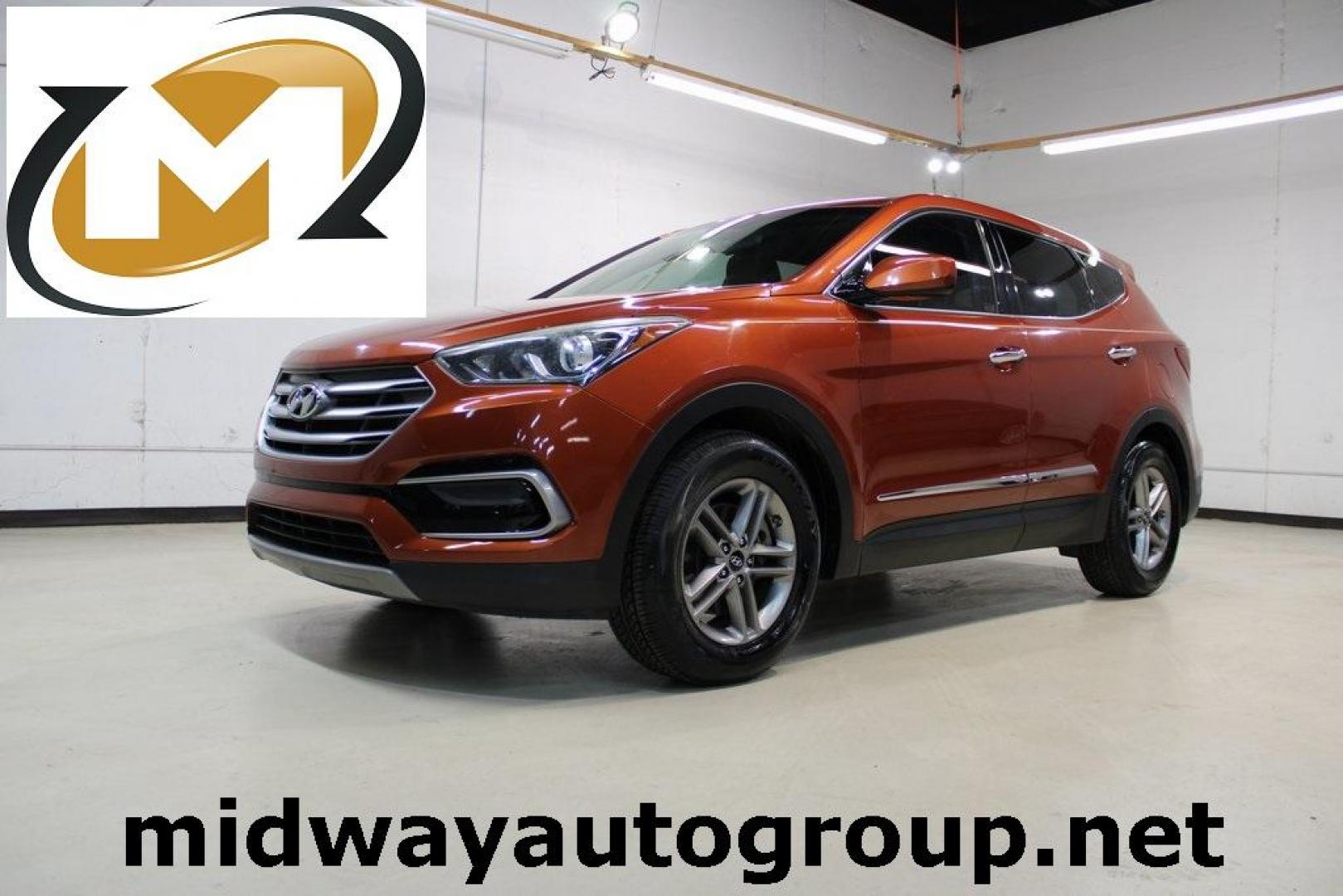 2017 Canyon Copper /Beige Hyundai Santa Fe Sport 2.4 Base (5XYZT3LB1HG) with an 2.4L I4 DGI DOHC 16V engine, Automatic transmission, located at 15300 Midway Rd., Addison, TX, 75001, (972) 702-0011, 32.958321, -96.838074 - Midway Auto Group in Addison, TX, is pleased to offer this 2017 Hyundai Santa Fe Sport, a versatile and stylish SUV that combines performance, comfort, and advanced features.<br><br>Key Features:<br><br>Engine and Performance: Powered by a 2.4-liter inline-4 engine, delivering a balance of power a - Photo#0