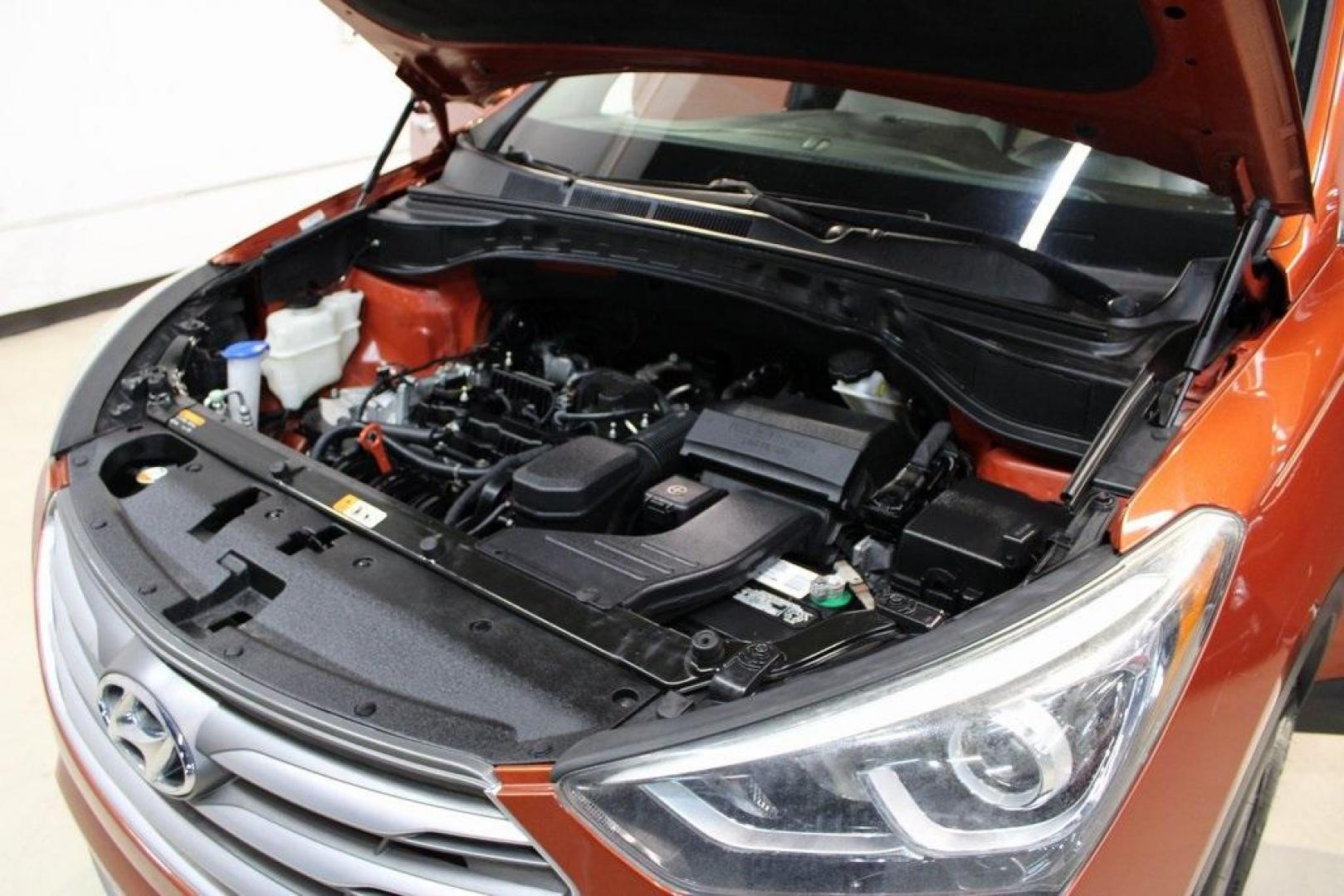 2017 Canyon Copper /Beige Hyundai Santa Fe Sport 2.4 Base (5XYZT3LB1HG) with an 2.4L I4 DGI DOHC 16V engine, Automatic transmission, located at 15300 Midway Rd., Addison, TX, 75001, (972) 702-0011, 32.958321, -96.838074 - Midway Auto Group in Addison, TX, is pleased to offer this 2017 Hyundai Santa Fe Sport, a versatile and stylish SUV that combines performance, comfort, and advanced features.<br><br>Key Features:<br><br>Engine and Performance: Powered by a 2.4-liter inline-4 engine, delivering a balance of power a - Photo#27
