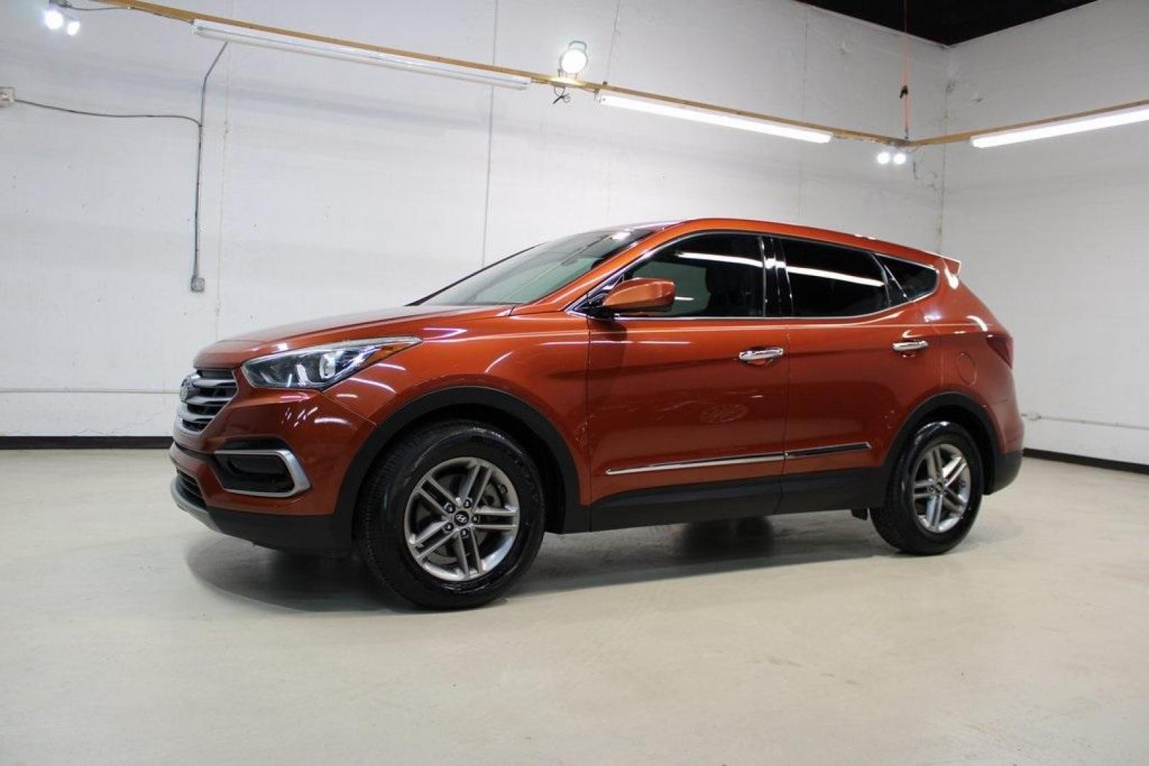 2017 Canyon Copper /Beige Hyundai Santa Fe Sport 2.4 Base (5XYZT3LB1HG) with an 2.4L I4 DGI DOHC 16V engine, Automatic transmission, located at 15300 Midway Rd., Addison, TX, 75001, (972) 702-0011, 32.958321, -96.838074 - Midway Auto Group in Addison, TX, is pleased to offer this 2017 Hyundai Santa Fe Sport, a versatile and stylish SUV that combines performance, comfort, and advanced features.<br><br>Key Features:<br><br>Engine and Performance: Powered by a 2.4-liter inline-4 engine, delivering a balance of power a - Photo#4