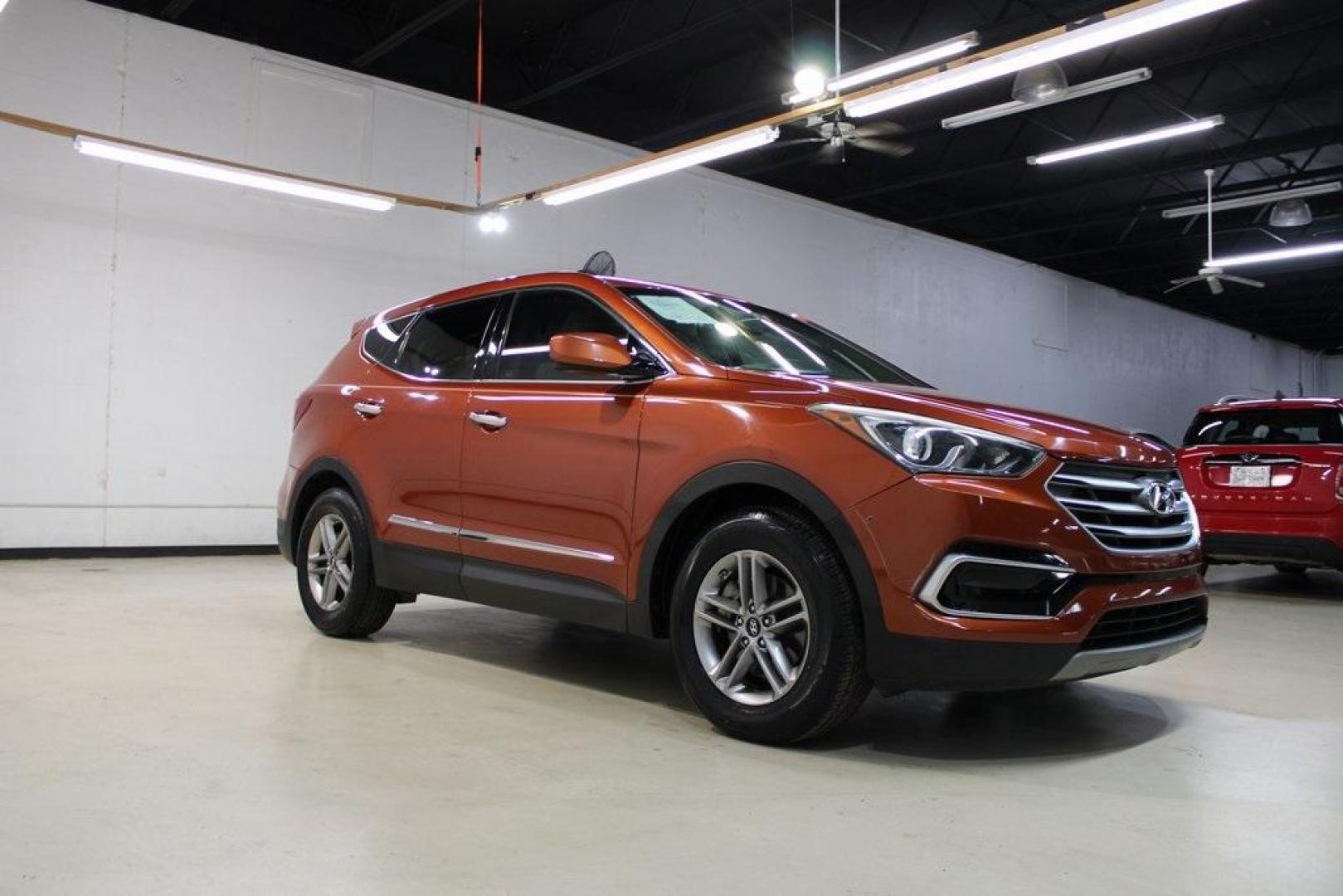 2017 Canyon Copper /Beige Hyundai Santa Fe Sport 2.4 Base (5XYZT3LB1HG) with an 2.4L I4 DGI DOHC 16V engine, Automatic transmission, located at 15300 Midway Rd., Addison, TX, 75001, (972) 702-0011, 32.958321, -96.838074 - Midway Auto Group in Addison, TX, is pleased to offer this 2017 Hyundai Santa Fe Sport, a versatile and stylish SUV that combines performance, comfort, and advanced features.<br><br>Key Features:<br><br>Engine and Performance: Powered by a 2.4-liter inline-4 engine, delivering a balance of power a - Photo#6