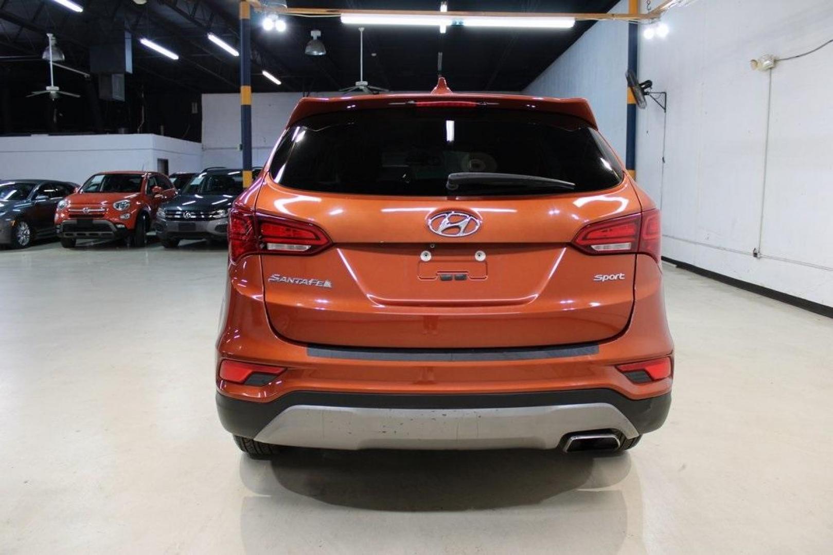 2017 Canyon Copper /Beige Hyundai Santa Fe Sport 2.4 Base (5XYZT3LB1HG) with an 2.4L I4 DGI DOHC 16V engine, Automatic transmission, located at 15300 Midway Rd., Addison, TX, 75001, (972) 702-0011, 32.958321, -96.838074 - Midway Auto Group in Addison, TX, is pleased to offer this 2017 Hyundai Santa Fe Sport, a versatile and stylish SUV that combines performance, comfort, and advanced features.<br><br>Key Features:<br><br>Engine and Performance: Powered by a 2.4-liter inline-4 engine, delivering a balance of power a - Photo#7