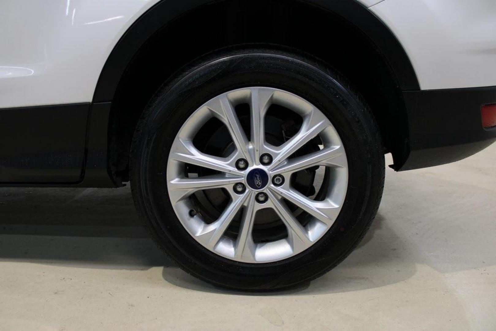2018 White Platinum /Medium Light Stone Ford Escape SEL (1FMCU9HD7JU) with an 1.5L EcoBoost engine, Automatic transmission, located at 15300 Midway Rd., Addison, TX, 75001, (972) 702-0011, 32.958321, -96.838074 - Midway Auto Group in Addison, TX, is pleased to offer this 2018 Ford Escape SEL, a versatile and stylish SUV designed to meet your driving needs.<br><br>Key Features:<br><br>Engine and Performance: Powered by a 1.5L EcoBoost engine paired with an automatic transmission, delivering a balanced blend - Photo#9