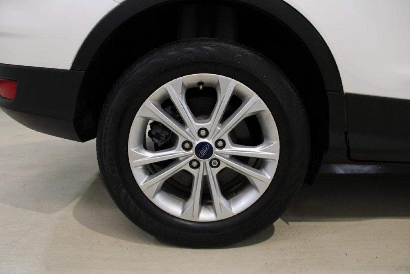 2018 White Platinum /Medium Light Stone Ford Escape SEL (1FMCU9HD7JU) with an 1.5L EcoBoost engine, Automatic transmission, located at 15300 Midway Rd., Addison, TX, 75001, (972) 702-0011, 32.958321, -96.838074 - Midway Auto Group in Addison, TX, is pleased to offer this 2018 Ford Escape SEL, a versatile and stylish SUV designed to meet your driving needs.<br><br>Key Features:<br><br>Engine and Performance: Powered by a 1.5L EcoBoost engine paired with an automatic transmission, delivering a balanced blend - Photo#10