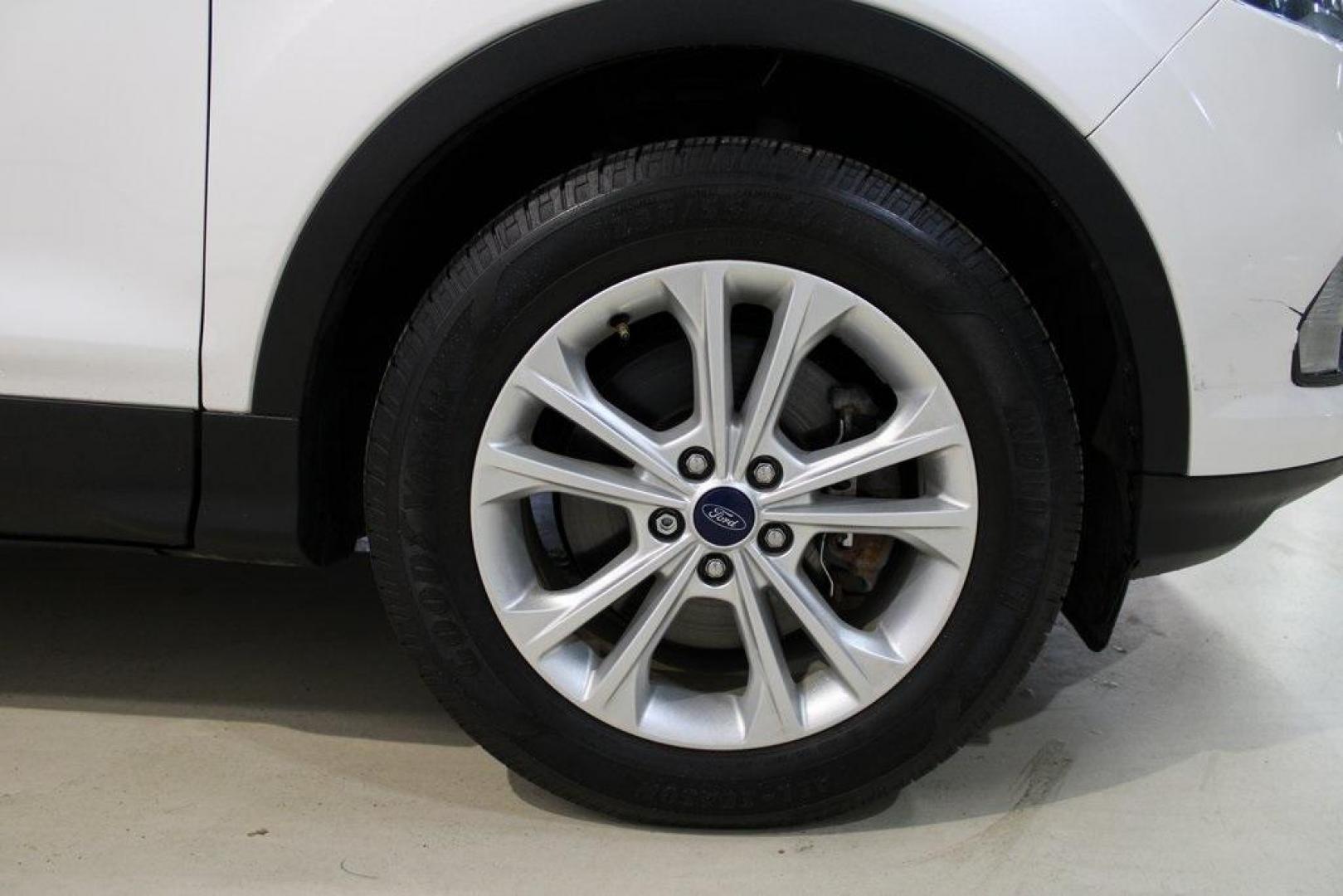 2018 White Platinum /Medium Light Stone Ford Escape SEL (1FMCU9HD7JU) with an 1.5L EcoBoost engine, Automatic transmission, located at 15300 Midway Rd., Addison, TX, 75001, (972) 702-0011, 32.958321, -96.838074 - Midway Auto Group in Addison, TX, is pleased to offer this 2018 Ford Escape SEL, a versatile and stylish SUV designed to meet your driving needs.<br><br>Key Features:<br><br>Engine and Performance: Powered by a 1.5L EcoBoost engine paired with an automatic transmission, delivering a balanced blend - Photo#11