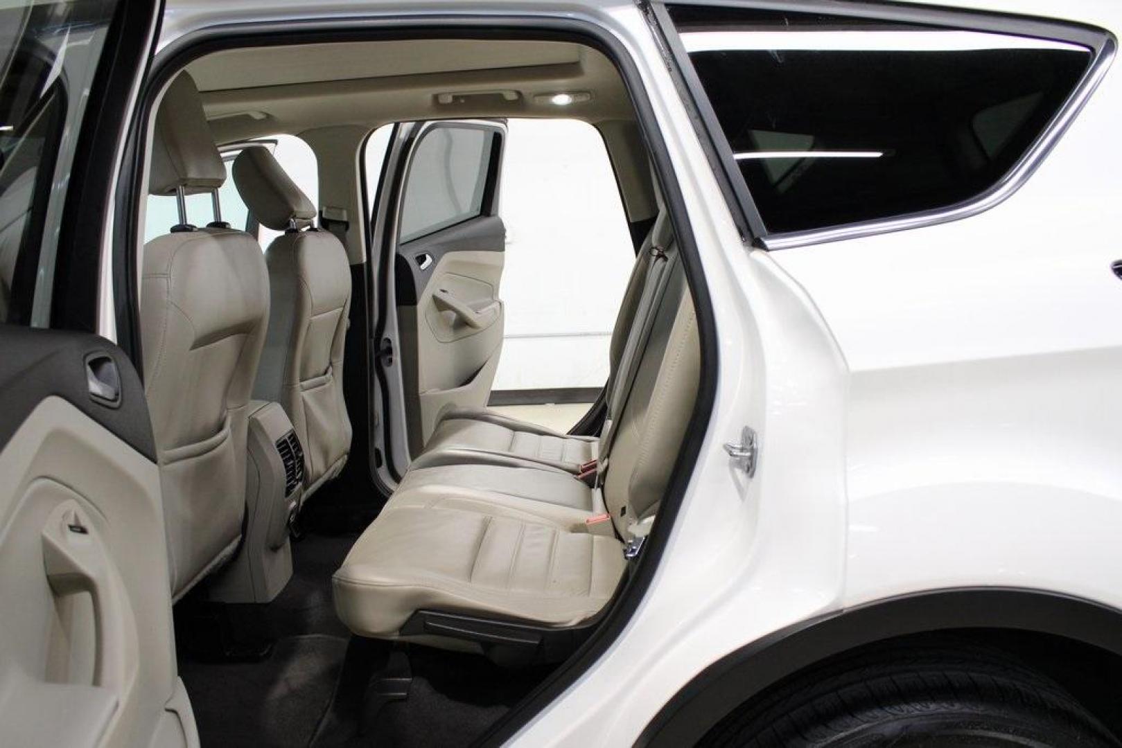 2018 White Platinum /Medium Light Stone Ford Escape SEL (1FMCU9HD7JU) with an 1.5L EcoBoost engine, Automatic transmission, located at 15300 Midway Rd., Addison, TX, 75001, (972) 702-0011, 32.958321, -96.838074 - Midway Auto Group in Addison, TX, is pleased to offer this 2018 Ford Escape SEL, a versatile and stylish SUV designed to meet your driving needs.<br><br>Key Features:<br><br>Engine and Performance: Powered by a 1.5L EcoBoost engine paired with an automatic transmission, delivering a balanced blend - Photo#16
