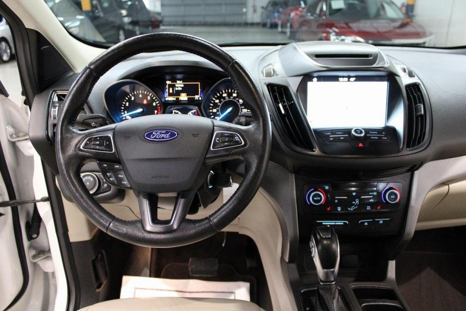 2018 White Platinum /Medium Light Stone Ford Escape SEL (1FMCU9HD7JU) with an 1.5L EcoBoost engine, Automatic transmission, located at 15300 Midway Rd., Addison, TX, 75001, (972) 702-0011, 32.958321, -96.838074 - Midway Auto Group in Addison, TX, is pleased to offer this 2018 Ford Escape SEL, a versatile and stylish SUV designed to meet your driving needs.<br><br>Key Features:<br><br>Engine and Performance: Powered by a 1.5L EcoBoost engine paired with an automatic transmission, delivering a balanced blend - Photo#17