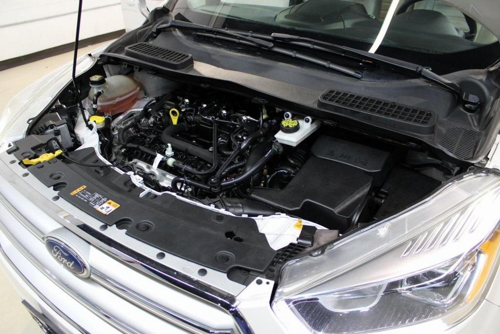 2018 White Platinum /Medium Light Stone Ford Escape SEL (1FMCU9HD7JU) with an 1.5L EcoBoost engine, Automatic transmission, located at 15300 Midway Rd., Addison, TX, 75001, (972) 702-0011, 32.958321, -96.838074 - Midway Auto Group in Addison, TX, is pleased to offer this 2018 Ford Escape SEL, a versatile and stylish SUV designed to meet your driving needs.<br><br>Key Features:<br><br>Engine and Performance: Powered by a 1.5L EcoBoost engine paired with an automatic transmission, delivering a balanced blend - Photo#30
