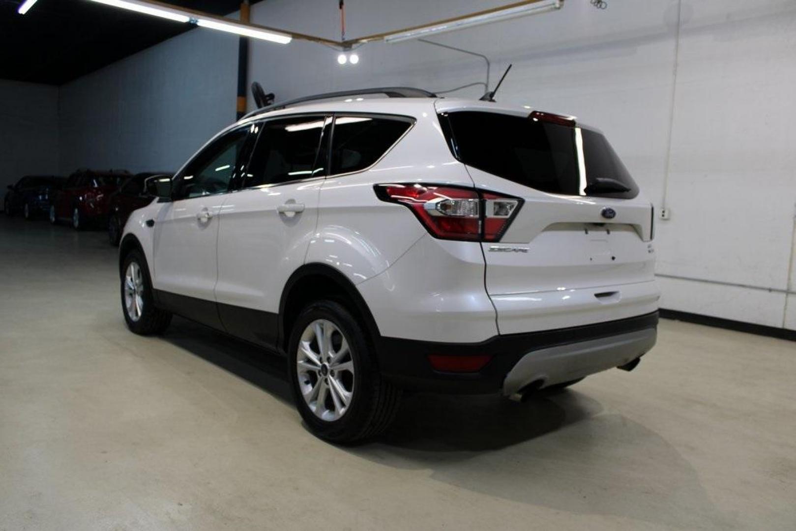 2018 White Platinum /Medium Light Stone Ford Escape SEL (1FMCU9HD7JU) with an 1.5L EcoBoost engine, Automatic transmission, located at 15300 Midway Rd., Addison, TX, 75001, (972) 702-0011, 32.958321, -96.838074 - Midway Auto Group in Addison, TX, is pleased to offer this 2018 Ford Escape SEL, a versatile and stylish SUV designed to meet your driving needs.<br><br>Key Features:<br><br>Engine and Performance: Powered by a 1.5L EcoBoost engine paired with an automatic transmission, delivering a balanced blend - Photo#3