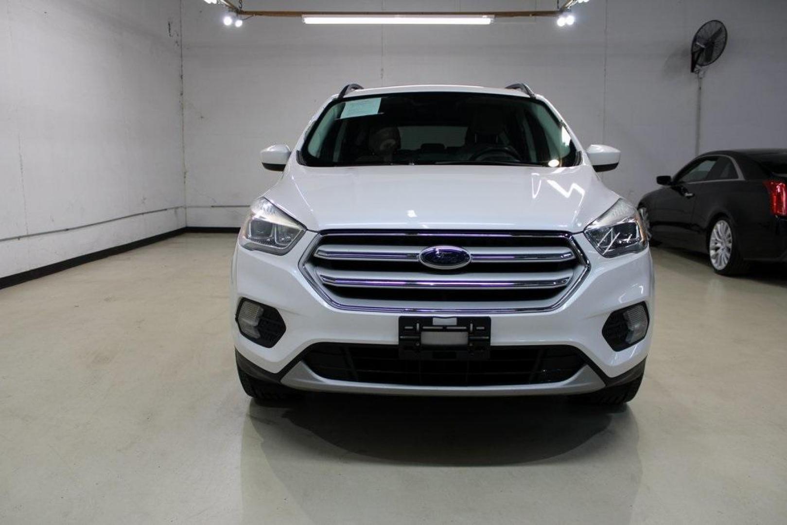 2018 White Platinum /Medium Light Stone Ford Escape SEL (1FMCU9HD7JU) with an 1.5L EcoBoost engine, Automatic transmission, located at 15300 Midway Rd., Addison, TX, 75001, (972) 702-0011, 32.958321, -96.838074 - Midway Auto Group in Addison, TX, is pleased to offer this 2018 Ford Escape SEL, a versatile and stylish SUV designed to meet your driving needs.<br><br>Key Features:<br><br>Engine and Performance: Powered by a 1.5L EcoBoost engine paired with an automatic transmission, delivering a balanced blend - Photo#5