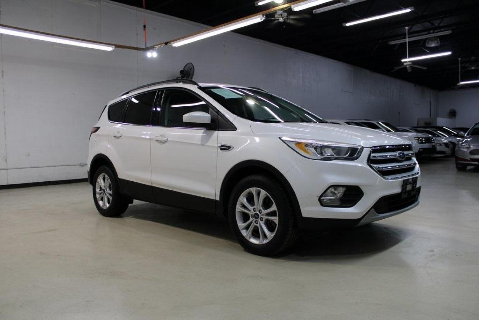 2018 White Platinum /Medium Light Stone Ford Escape SEL (1FMCU9HD7JU) with an 1.5L EcoBoost engine, Automatic transmission, located at 15300 Midway Rd., Addison, TX, 75001, (972) 702-0011, 32.958321, -96.838074 - Midway Auto Group in Addison, TX, is pleased to offer this 2018 Ford Escape SEL, a versatile and stylish SUV designed to meet your driving needs.<br><br>Key Features:<br><br>Engine and Performance: Powered by a 1.5L EcoBoost engine paired with an automatic transmission, delivering a balanced blend - Photo#6
