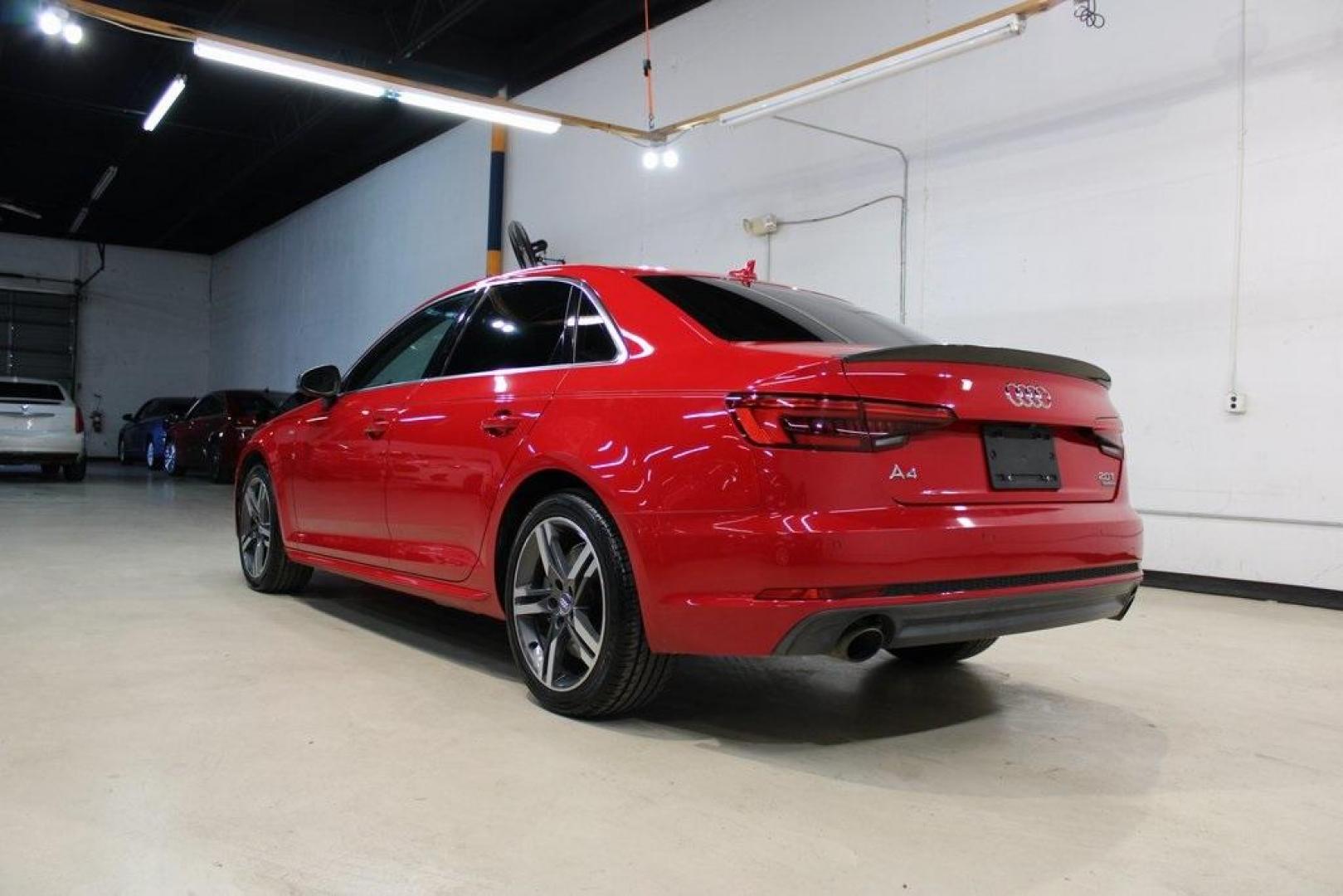 2017 Tango Red /Black Audi A4 2.0T Premium Plus (WAUENAF44HN) with an 2.0L I4 TFSI DOHC engine, Automatic transmission, located at 15300 Midway Rd., Addison, TX, 75001, (972) 702-0011, 32.958321, -96.838074 - Midway Auto Group in Addison, TX, is pleased to offer this 2017 Audi A4 Premium Plus, a luxury sedan that seamlessly blends performance, advanced technology, and sophisticated design.<br><br>Key Features:<br><br>Engine and Performance: Powered by a 2.0-liter TFSI turbocharged engine delivering 252 - Photo#3