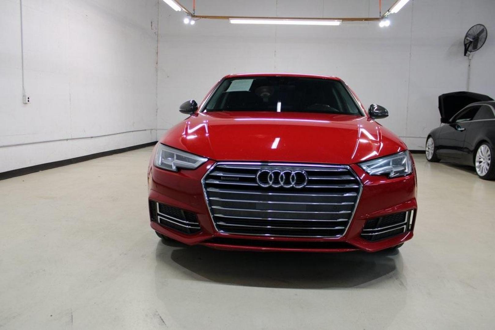 2017 Tango Red /Black Audi A4 2.0T Premium Plus (WAUENAF44HN) with an 2.0L I4 TFSI DOHC engine, Automatic transmission, located at 15300 Midway Rd., Addison, TX, 75001, (972) 702-0011, 32.958321, -96.838074 - Midway Auto Group in Addison, TX, is pleased to offer this 2017 Audi A4 Premium Plus, a luxury sedan that seamlessly blends performance, advanced technology, and sophisticated design.<br><br>Key Features:<br><br>Engine and Performance: Powered by a 2.0-liter TFSI turbocharged engine delivering 252 - Photo#5