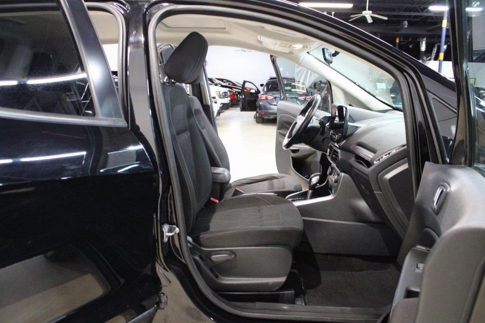 2018 Shadow Black /Ebony Black Ford EcoSport SE (MAJ3P1TE1JC) with an EcoBoost 1.0L I3 GTDi DOHC Turbocharged VCT engine, Automatic transmission, located at 15300 Midway Rd., Addison, TX, 75001, (972) 702-0011, 32.958321, -96.838074 - Midway Auto Group in Addison, TX, is excited to present this 2018 Ford EcoSport SE, a compact SUV that combines versatility, efficiency, and modern features to enhance your driving experience.<br><br>Key Features:<br><br>Engine and Performance: Powered by a 1.0-liter EcoBoost turbocharged engine, - Photo#14