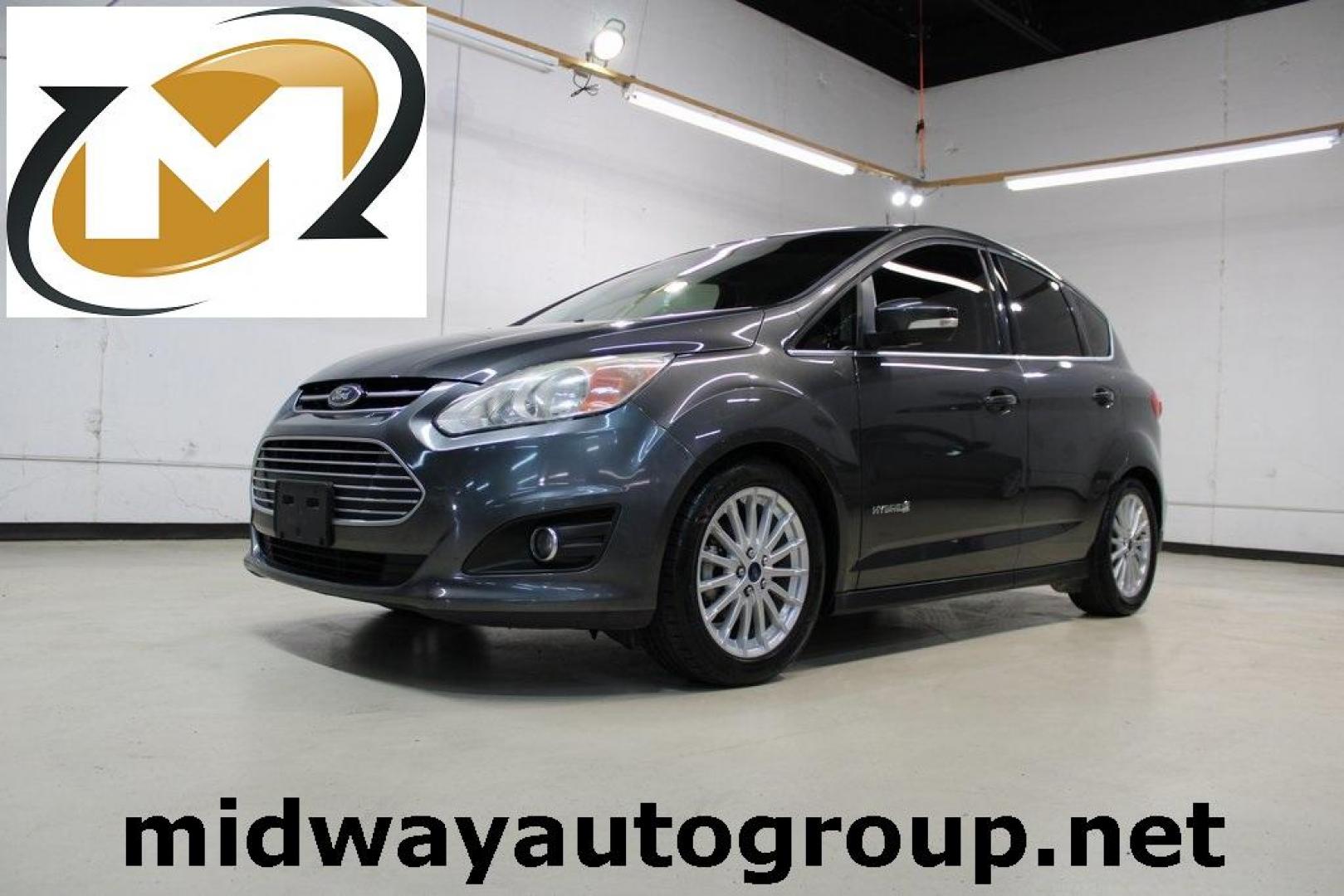 2015 Magnetic /Medium Light Stone Ford C-Max Hybrid SEL (1FADP5BU1FL) with an I4 Hybrid engine, CVT transmission, located at 15300 Midway Rd., Addison, TX, 75001, (972) 702-0011, 32.958321, -96.838074 - Midway Auto Group in Addison, TX, is pleased to offer this 2015 Ford C-Max SEL Hybrid, a versatile and fuel-efficient hatchback designed to enhance your driving experience. With 72,000 miles on the odometer, this well-maintained vehicle is available for $9,950. <br><br><br>Key Features:<br><br>Conve - Photo#0