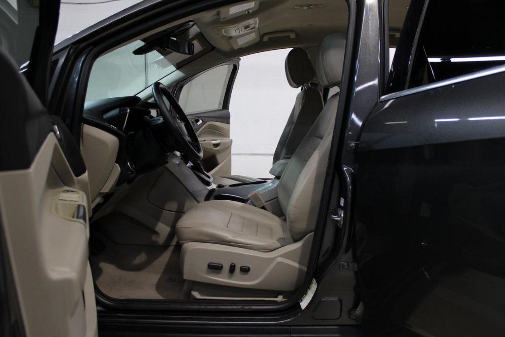 2015 Magnetic /Medium Light Stone Ford C-Max Hybrid SEL (1FADP5BU1FL) with an I4 Hybrid engine, CVT transmission, located at 15300 Midway Rd., Addison, TX, 75001, (972) 702-0011, 32.958321, -96.838074 - Midway Auto Group in Addison, TX, is pleased to offer this 2015 Ford C-Max SEL Hybrid, a versatile and fuel-efficient hatchback designed to enhance your driving experience. With 72,000 miles on the odometer, this well-maintained vehicle is available for $9,950. <br><br><br>Key Features:<br><br>Conve - Photo#13