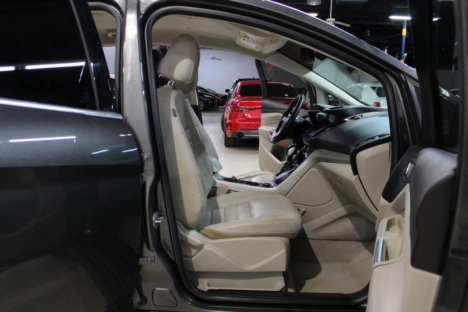 2015 Magnetic /Medium Light Stone Ford C-Max Hybrid SEL (1FADP5BU1FL) with an I4 Hybrid engine, CVT transmission, located at 15300 Midway Rd., Addison, TX, 75001, (972) 702-0011, 32.958321, -96.838074 - Midway Auto Group in Addison, TX, is pleased to offer this 2015 Ford C-Max SEL Hybrid, a versatile and fuel-efficient hatchback designed to enhance your driving experience. With 72,000 miles on the odometer, this well-maintained vehicle is available for $9,950. <br><br><br>Key Features:<br><br>Conve - Photo#14
