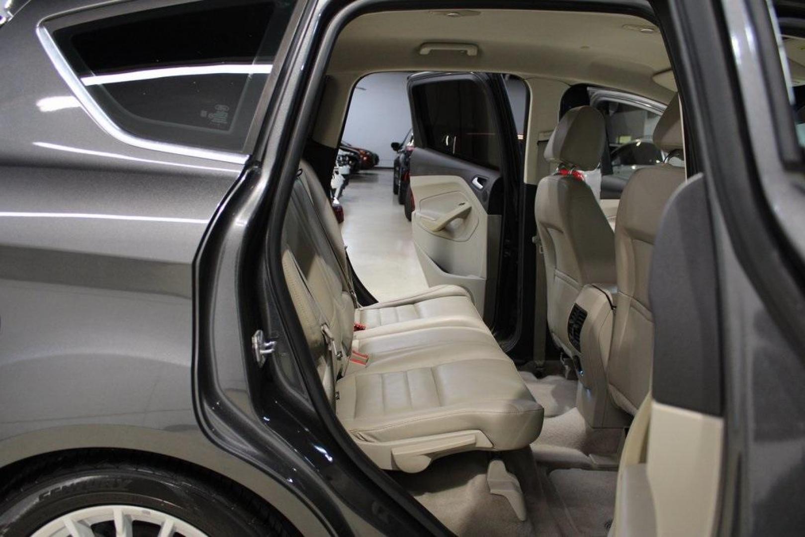 2015 Magnetic /Medium Light Stone Ford C-Max Hybrid SEL (1FADP5BU1FL) with an I4 Hybrid engine, CVT transmission, located at 15300 Midway Rd., Addison, TX, 75001, (972) 702-0011, 32.958321, -96.838074 - Midway Auto Group in Addison, TX, is pleased to offer this 2015 Ford C-Max SEL Hybrid, a versatile and fuel-efficient hatchback designed to enhance your driving experience. With 72,000 miles on the odometer, this well-maintained vehicle is available for $9,950. <br><br><br>Key Features:<br><br>Conve - Photo#15