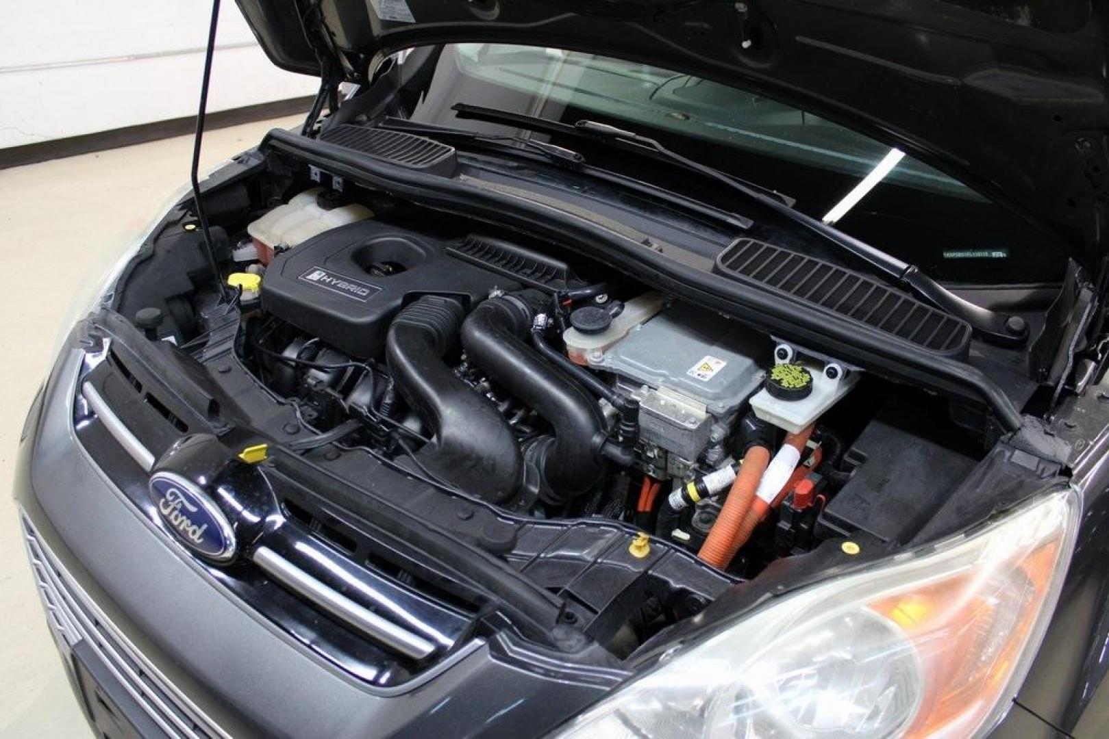 2015 Magnetic /Medium Light Stone Ford C-Max Hybrid SEL (1FADP5BU1FL) with an I4 Hybrid engine, CVT transmission, located at 15300 Midway Rd., Addison, TX, 75001, (972) 702-0011, 32.958321, -96.838074 - Midway Auto Group in Addison, TX, is pleased to offer this 2015 Ford C-Max SEL Hybrid, a versatile and fuel-efficient hatchback designed to enhance your driving experience. With 72,000 miles on the odometer, this well-maintained vehicle is available for $9,950. <br><br><br>Key Features:<br><br>Conve - Photo#29