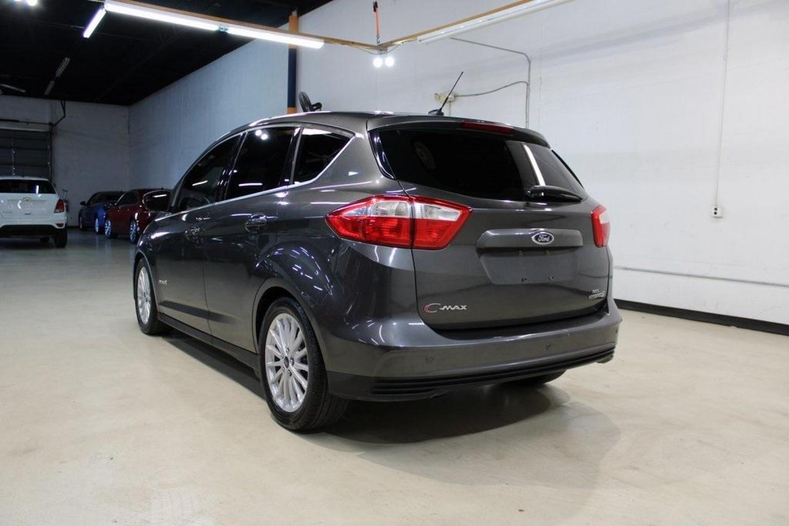 2015 Magnetic /Medium Light Stone Ford C-Max Hybrid SEL (1FADP5BU1FL) with an I4 Hybrid engine, CVT transmission, located at 15300 Midway Rd., Addison, TX, 75001, (972) 702-0011, 32.958321, -96.838074 - Midway Auto Group in Addison, TX, is pleased to offer this 2015 Ford C-Max SEL Hybrid, a versatile and fuel-efficient hatchback designed to enhance your driving experience. With 72,000 miles on the odometer, this well-maintained vehicle is available for $9,950. <br><br><br>Key Features:<br><br>Conve - Photo#3