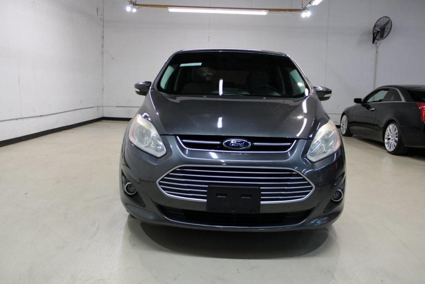 2015 Magnetic /Medium Light Stone Ford C-Max Hybrid SEL (1FADP5BU1FL) with an I4 Hybrid engine, CVT transmission, located at 15300 Midway Rd., Addison, TX, 75001, (972) 702-0011, 32.958321, -96.838074 - Midway Auto Group in Addison, TX, is pleased to offer this 2015 Ford C-Max SEL Hybrid, a versatile and fuel-efficient hatchback designed to enhance your driving experience. With 72,000 miles on the odometer, this well-maintained vehicle is available for $9,950. <br><br><br>Key Features:<br><br>Conve - Photo#5
