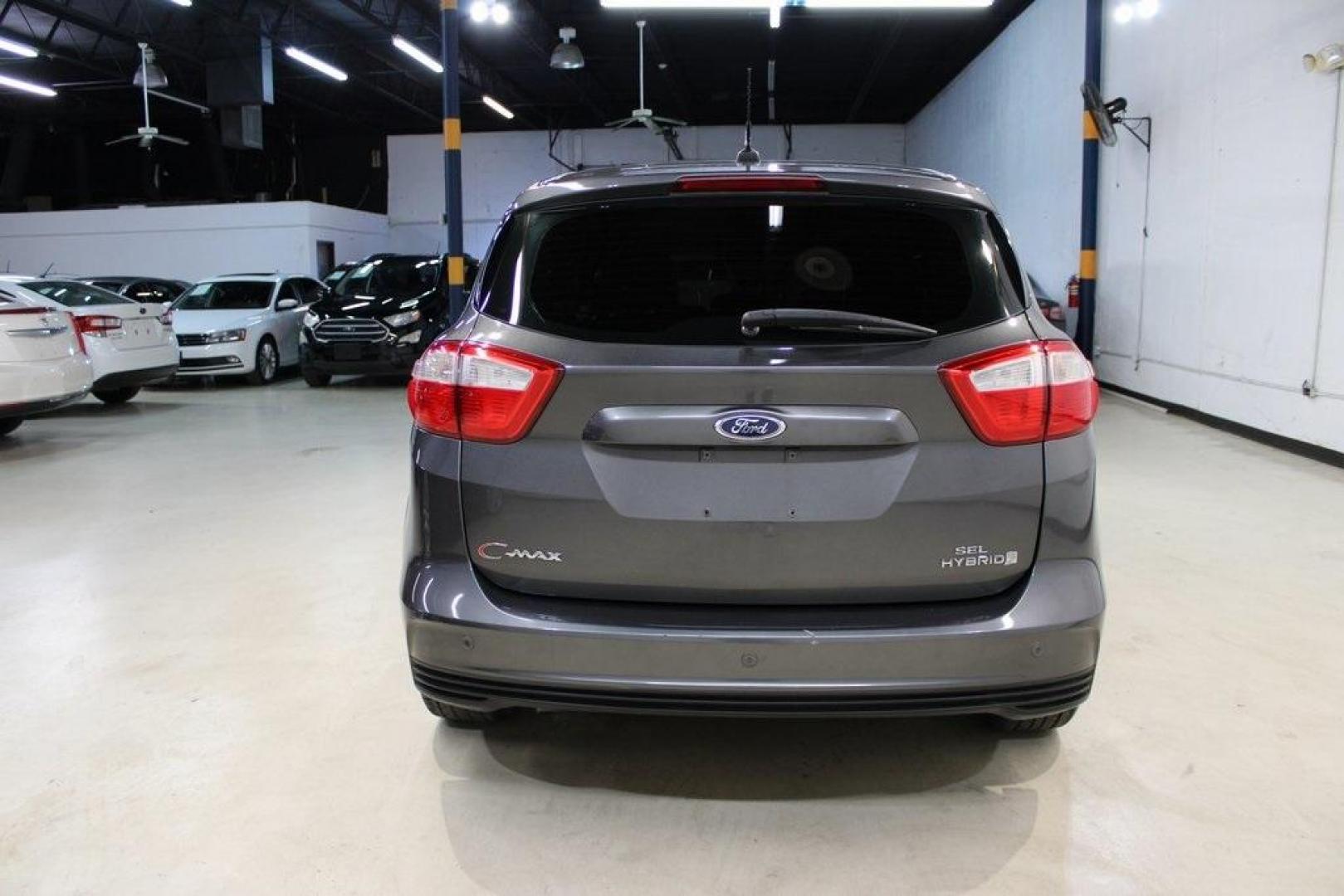 2015 Magnetic /Medium Light Stone Ford C-Max Hybrid SEL (1FADP5BU1FL) with an I4 Hybrid engine, CVT transmission, located at 15300 Midway Rd., Addison, TX, 75001, (972) 702-0011, 32.958321, -96.838074 - Midway Auto Group in Addison, TX, is pleased to offer this 2015 Ford C-Max SEL Hybrid, a versatile and fuel-efficient hatchback designed to enhance your driving experience. With 72,000 miles on the odometer, this well-maintained vehicle is available for $9,950. <br><br><br>Key Features:<br><br>Conve - Photo#7