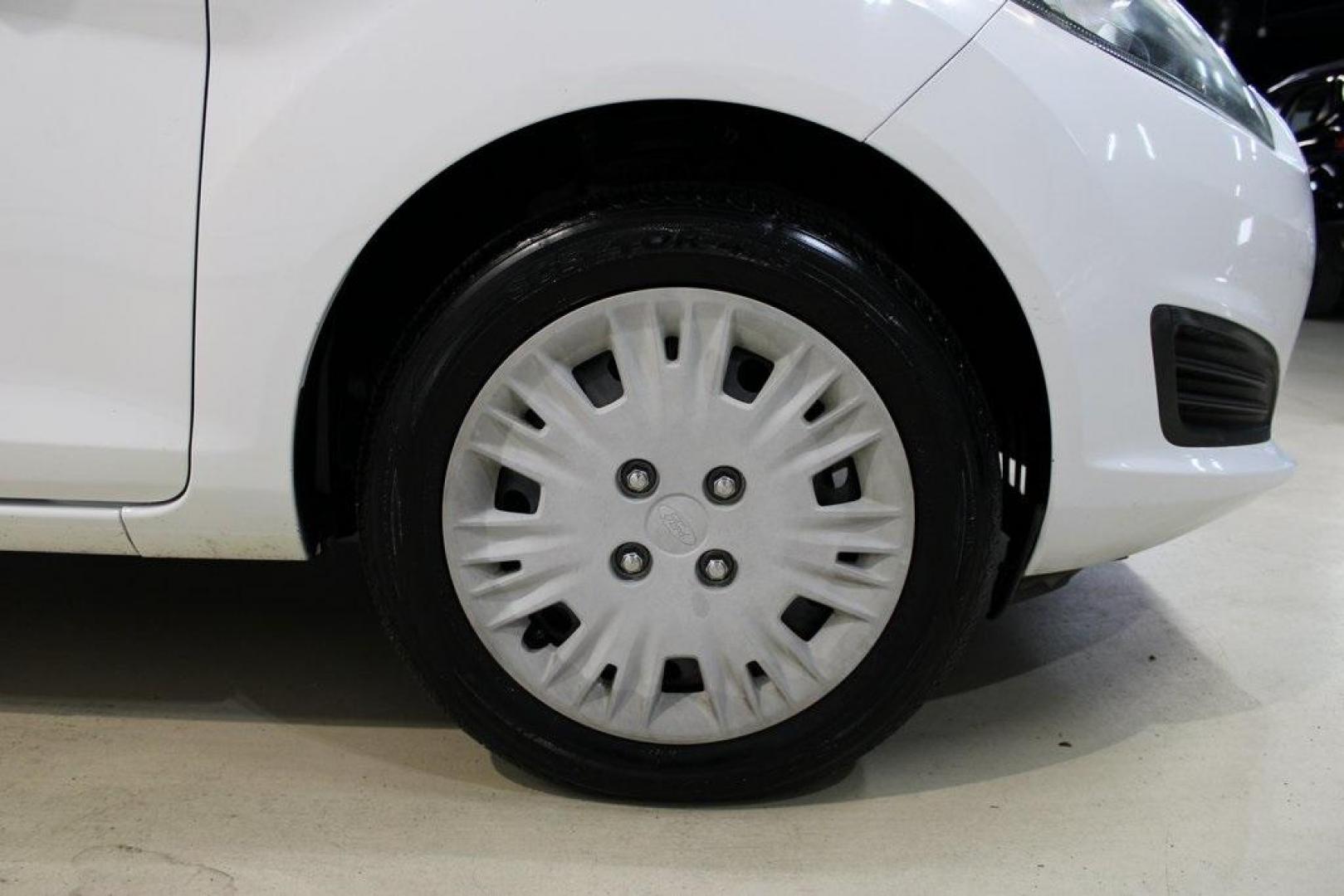 2017 Oxford White /Black Ford Fiesta S (3FADP4AJ9HM) with an 1.6L I4 Ti-VCT engine, Automatic transmission, located at 15300 Midway Rd., Addison, TX, 75001, (972) 702-0011, 32.958321, -96.838074 - Introducing the 2017 Ford Fiesta S Sedan, now available at Midway Auto Group in Addison, Texas. This compact, efficient, and budget-friendly sedan is designed for everyday drivability. Whether you're commuting to work or searching for a reliable first car, the Fiesta delivers dependable performance - Photo#11
