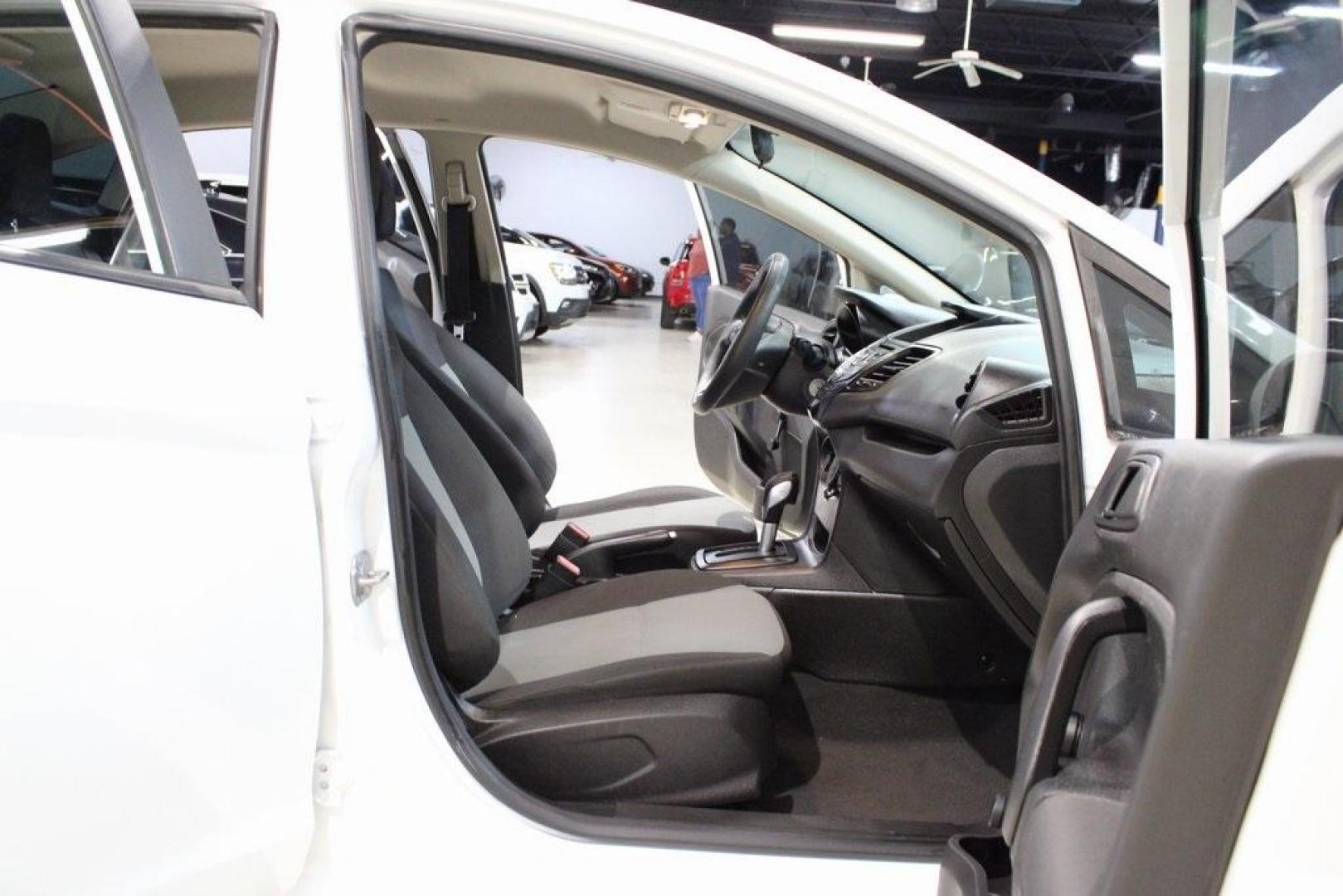 2017 Oxford White /Black Ford Fiesta S (3FADP4AJ9HM) with an 1.6L I4 Ti-VCT engine, Automatic transmission, located at 15300 Midway Rd., Addison, TX, 75001, (972) 702-0011, 32.958321, -96.838074 - Introducing the 2017 Ford Fiesta S Sedan, now available at Midway Auto Group in Addison, Texas. This compact, efficient, and budget-friendly sedan is designed for everyday drivability. Whether you're commuting to work or searching for a reliable first car, the Fiesta delivers dependable performance - Photo#12