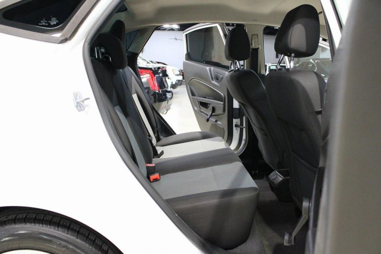 2017 Oxford White /Black Ford Fiesta S (3FADP4AJ9HM) with an 1.6L I4 Ti-VCT engine, Automatic transmission, located at 15300 Midway Rd., Addison, TX, 75001, (972) 702-0011, 32.958321, -96.838074 - Introducing the 2017 Ford Fiesta S Sedan, now available at Midway Auto Group in Addison, Texas. This compact, efficient, and budget-friendly sedan is designed for everyday drivability. Whether you're commuting to work or searching for a reliable first car, the Fiesta delivers dependable performance - Photo#13